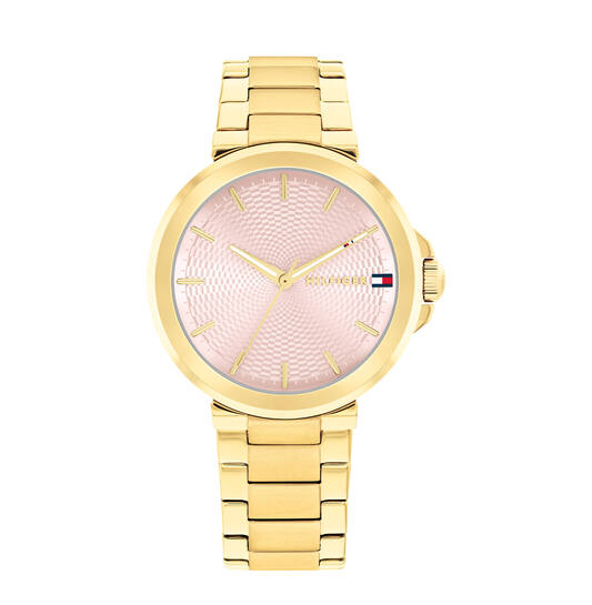 Op zoek naar een stijlvol horloge dat zowel trendy als tijdloos is? Dan is de TOMMY HILFIGER LORI TH1782779 het perfecte horloge voor jou! Dit prachtige horloge heeft een analoge tijdsaanduiding en een quartz uurwerk, wat zorgt voor een nauwkeurige en betrouwbare tijdmeting.

De TOMMY HILFIGER LORI TH1782779 heeft een diameter van 34 mm en een hoogte van 8 mm, waardoor het horloge perfect is voor zowel mannen als vrouwen. De vorm van de behuizing is rond en de kleur van de behuizing is goudkleurig. De behuizing is gemaakt van roestvrij staal, wat zorgt voor een duurzaam en kwalitatief horloge.

De wijzerplaat van de TOMMY HILFIGER LORI TH1782779 is roze van kleur en het glas is gemaakt van mineraal, wat zorgt voor een krasbestendig en helder horloge. De band van het horloge is ook goudkleurig en gemaakt van roestvrij staal, wat zorgt voor een comfortabele en luxe uitstraling.
