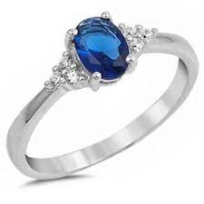 RX8179W7X5SA 14k witgouden ring met 6 brillant en 7x5 saffier