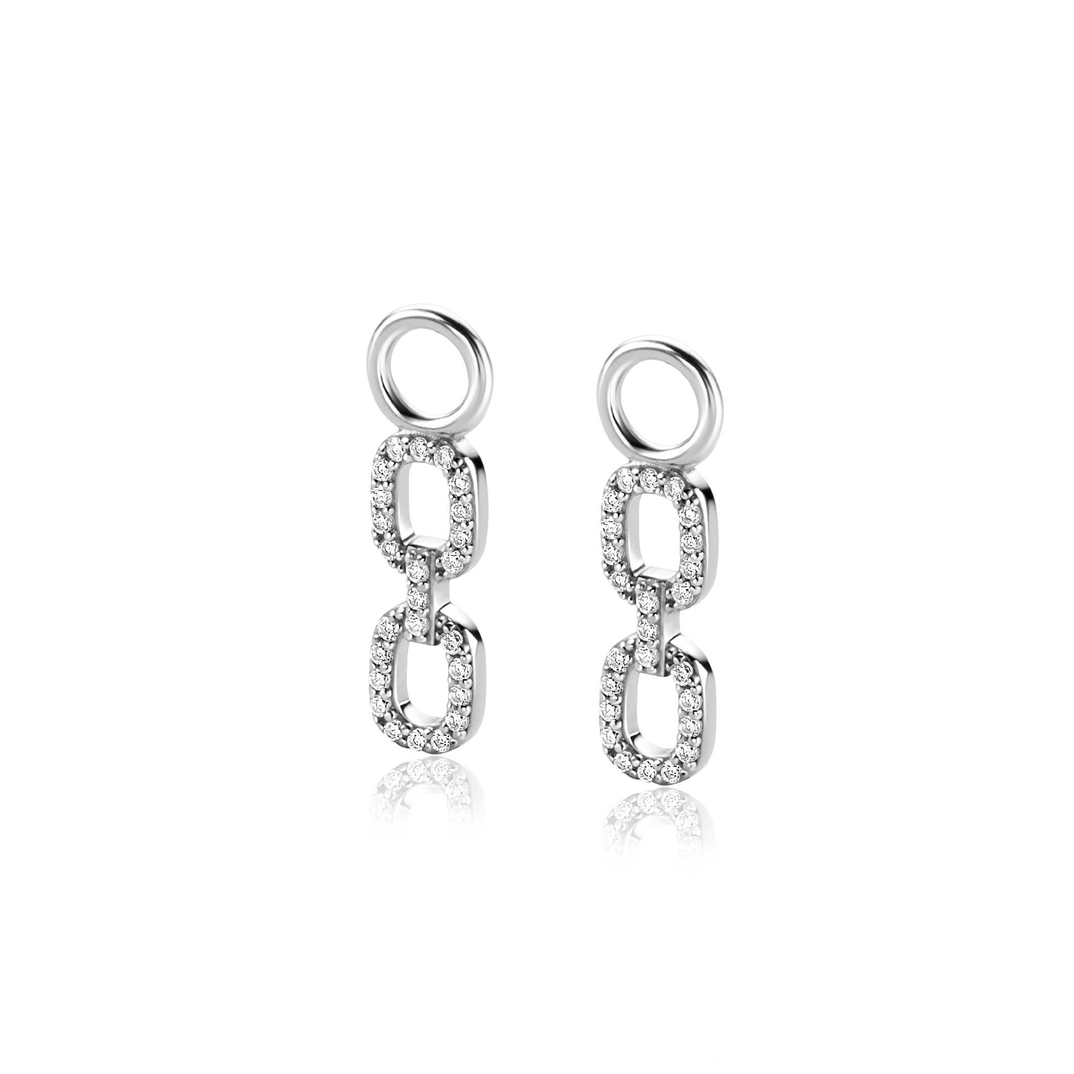ZINZI zilveren oorbedels met twee trendy ovale schakels, schitterend bezet met witte zirconia's. De oorbedels zijn 19mm lang. Hang deze oorbedels sierlijk aan je zilveren ZINZI oorringen. De oorringen zijn niet bij de prijs inbegrepen. Vervaardigd van eerste gehalte zilver (925) en voorzien van een extra rodiumlaag voor een langdurige glans.