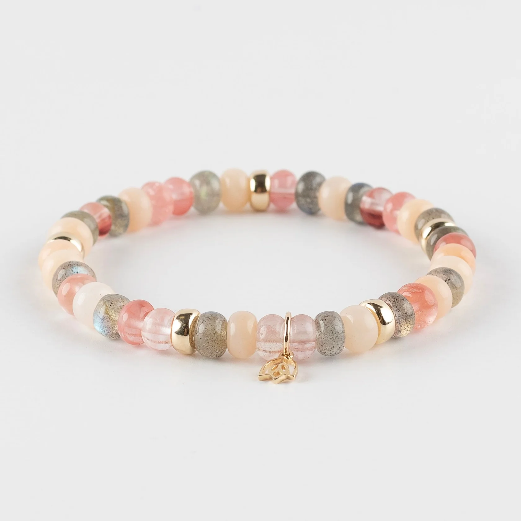 Edelstenen armband (6x4mm kralen) - Vijf gouden beads en tulp logo in 14k goud

Donkere labrodoriet - Rozenkwarts - Aventurijn

Grijs en roze; Een perfecte combinatie. De verschillende tinten roze maken deze armband heel vrouwelijk. De prachtige labradoriet stenen geven deze armband een tijdloze en stoere touch.