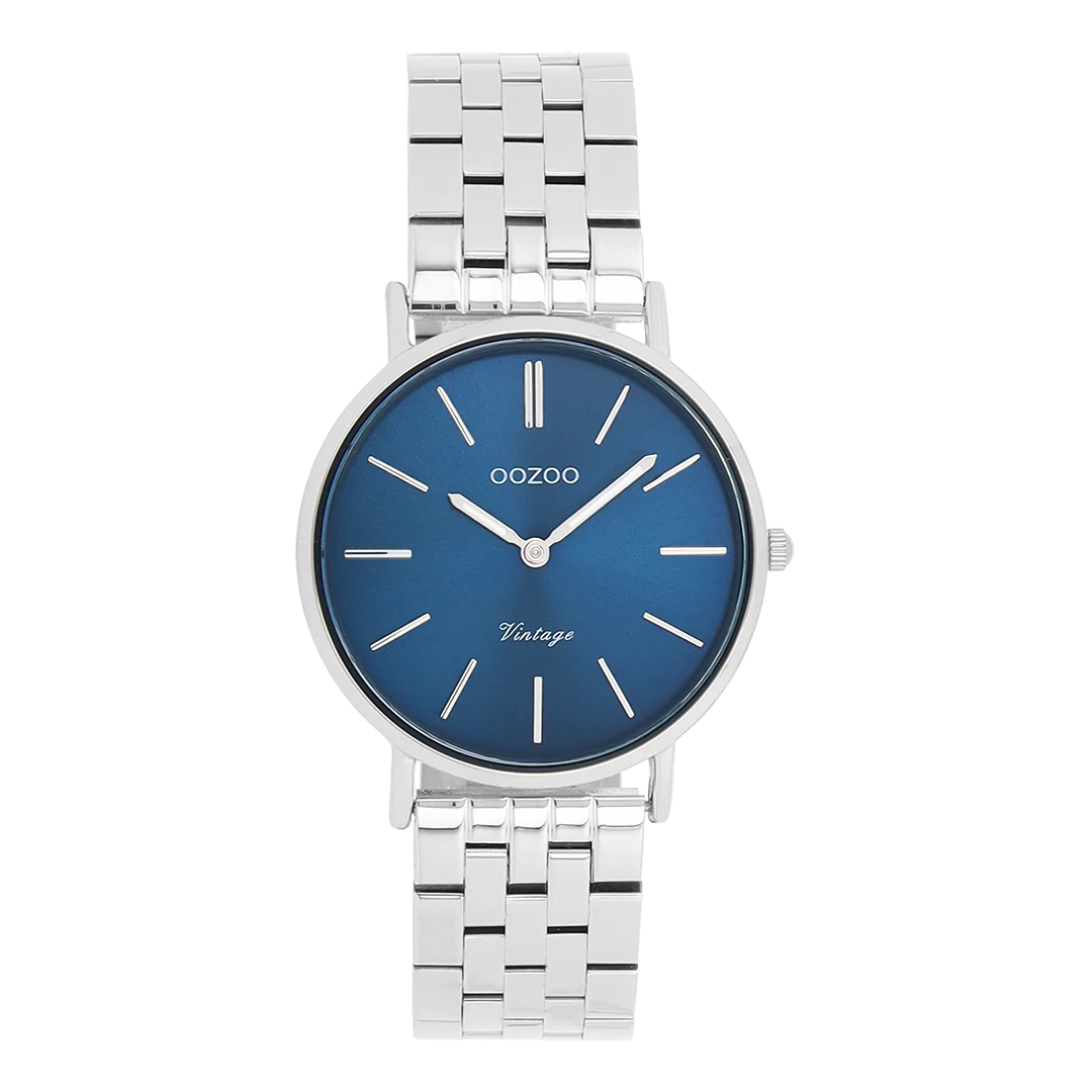De Oozoo horloge, modelnummer C20406, heeft een zilverkleurige look met een blauwe wijzerplaat en een roestvrijstalen band. Het heeft een analoge aanduiding met streepjesindexen en is nikkelvrij. Dit ronde polshorloge zonder datum- of verlichtingsfunctie is ideaal voor dagelijks gebruik en speciale gelegenheden. Combineer met zilverkleurige accessoires voor een stijlvolle uitstraling.