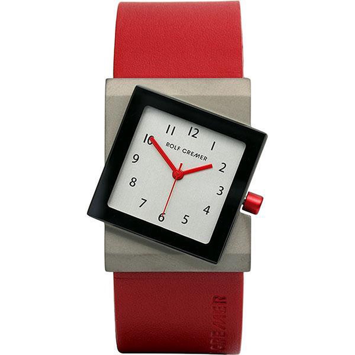 Leuk vorm gegeven horloge met asymmetrische rode  kroon en rode wijzers. De rood leren band maakt het geheel af.
