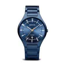 Bering herenhorloge, blauwe titanium band en kast, blauwe wijzerplaat met datum.