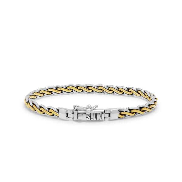 Deze 749 bi-color armband combineert 925 sterling zilver met het niet-edele metaal messing, wat resulteert in een opvallend tweekleurig design. Door de messing kleur straalt de armband luxe en ruwheid tegelijk uit. Alle RAW editions armbanden zijn "made to fade", wat betekent dat het messing na verloop van tijd van kleur kan veranderen. Je armband zal krassen en vervagen, waardoor het een uniek verhaal vertelt. Juist deze RAW worn-style look maakt deze armbanden zo bijzonder!