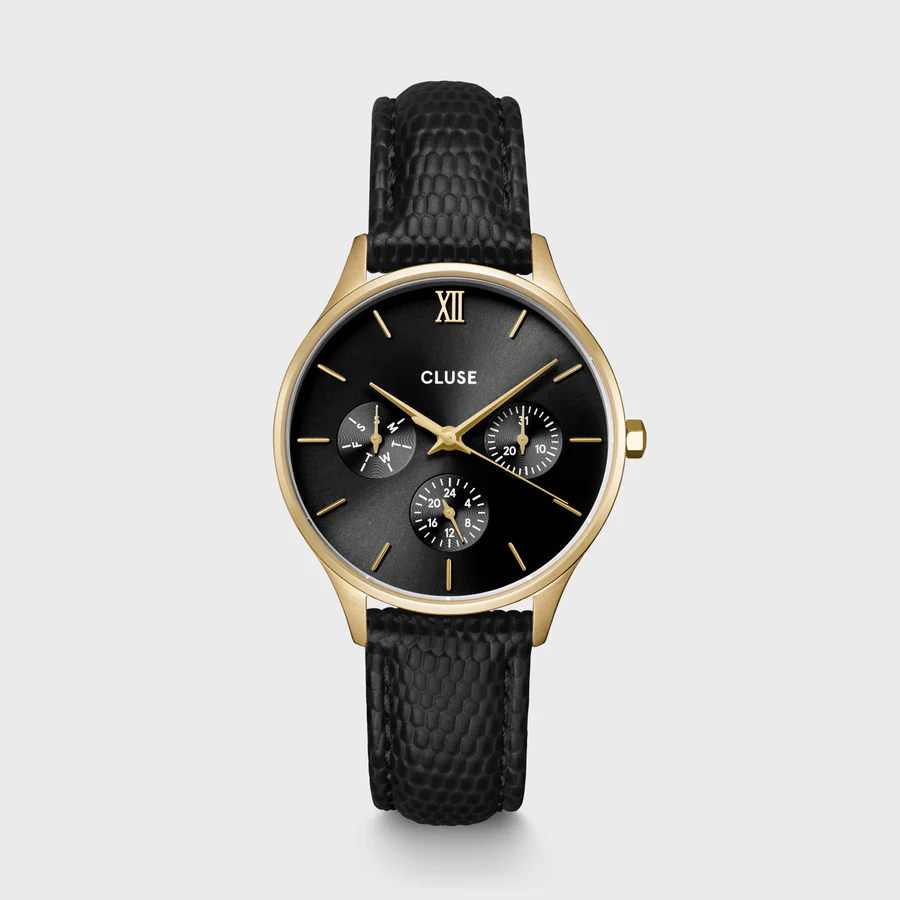 Het ronde Minuit multifunctionele horloge voor dames heeft een goudkleurige kast van 34 mm, een zwarte wijzerplaat met 3 subwijzerplaten en een zwarte leren band van 16 mm met hagedissenmotief.

Personaliseer je horloge eenvoudig met elke CLUSE 16 mm band. Je kunt de bandmaat zelf aanpassen.