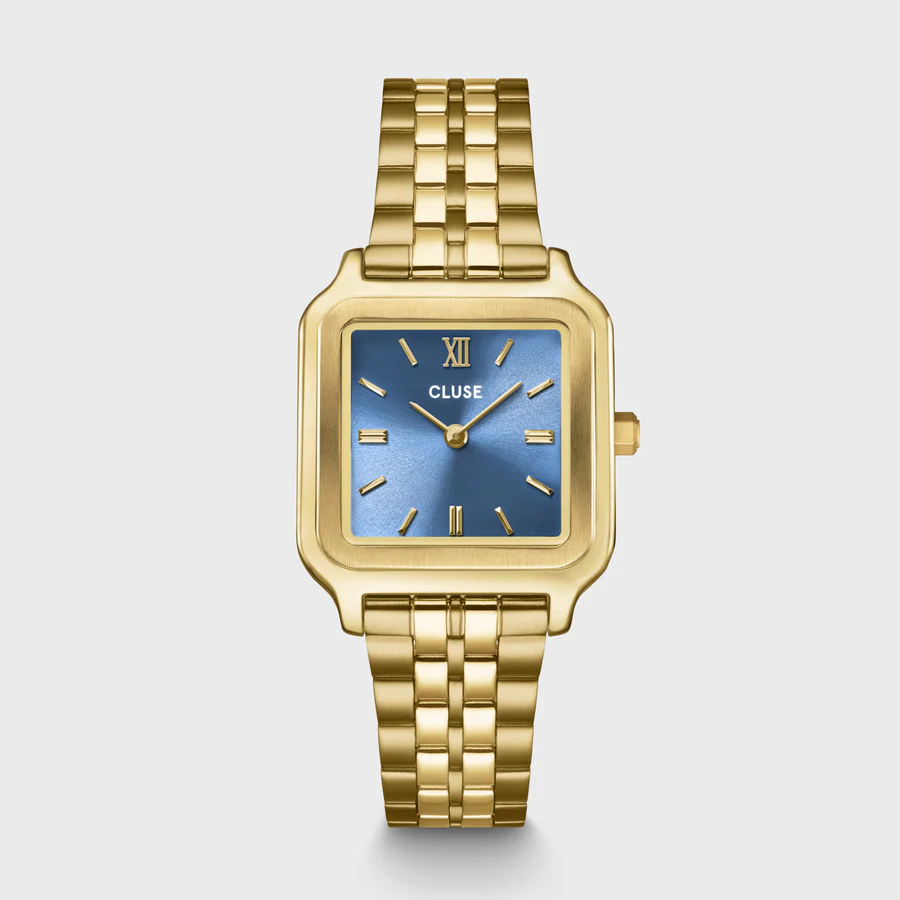 Voeg een vleugje kleur toe aan je look met het Gracieuse horloge voor dames in de kleur kyanietblauw en goud. Met een vierkante goudkleurige kast, een 16 mm 5-link band en een kyanietblauwe wijzerplaat met bijpassende kroon.