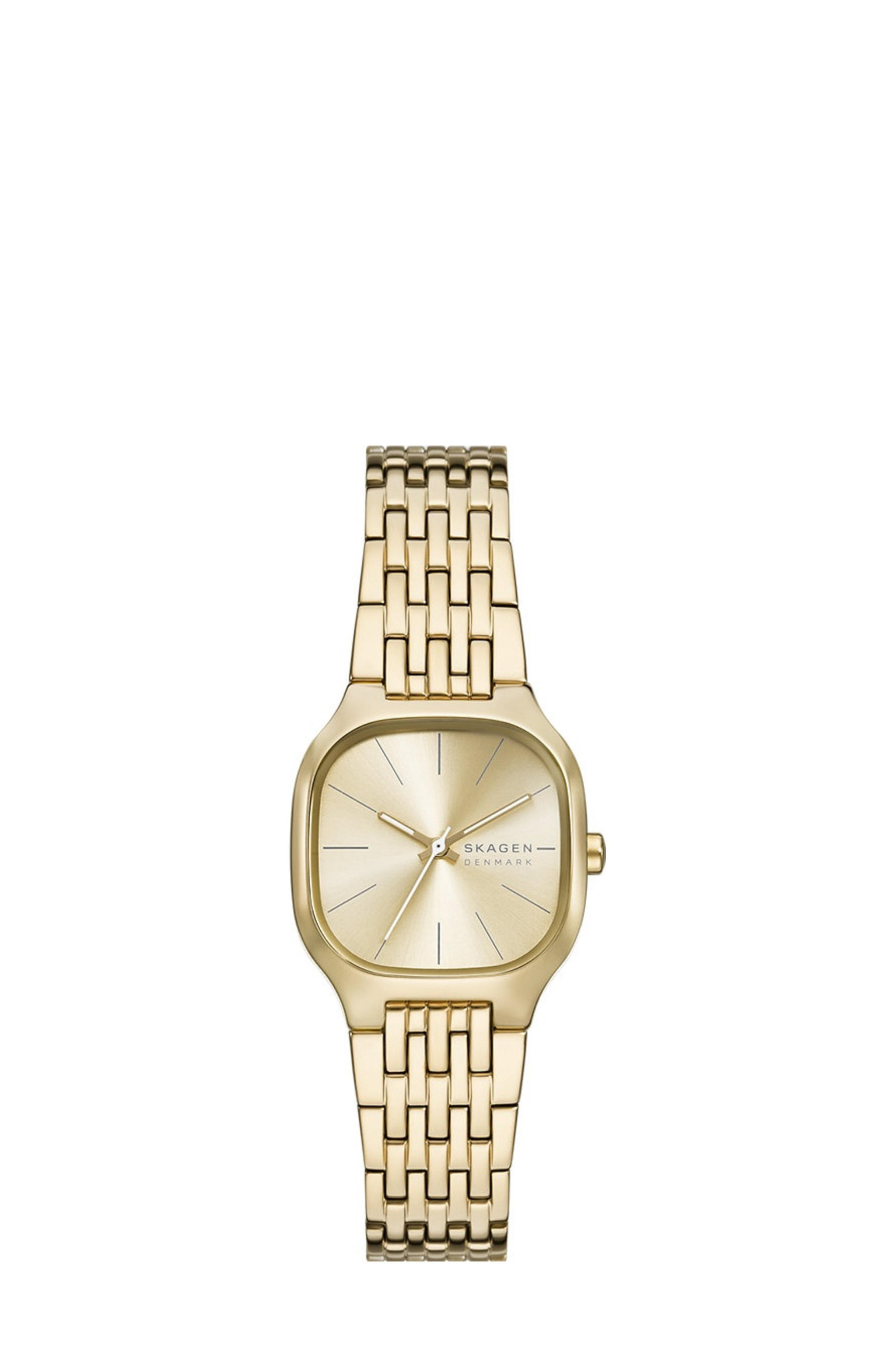 De Skagen horloge SKW3162 is een elegant polshorloge met een goudenkleurige roestvrijstalen kast en band. Het heeft een mineraalglas, analoge indicaties, en een kwartsuurwerk. De tonneau-vormige kast is antiallergisch en nikkelvrij. Ideaal voor formele gelegenheden of dagelijks gebruik, dankzij zijn subtiele design zonder datumfunctie. Draag met stijlvolle outfits voor een verfijnde look.
