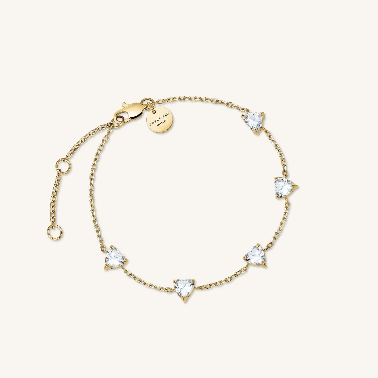 De Rosefield Row Hearts Bracelet JBRHG-J1013 is een verfijnde armband met hartjesdetails. Gemaakt van hoogwaardig materiaal, straalt hij elegantie uit. Perfect voor dagelijks gebruik of speciale gelegenheden. Draag hem solo voor een subtiele look, of combineer met andere Rosefield sieraden voor een gelaagd effect. Een stijlvolle aanvulling op elke outfit.