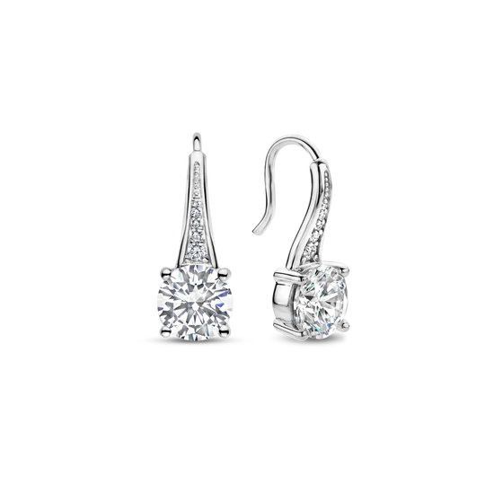 Deze TI SENTO zilveren oorbellen 7950ZI pronken met twee schitterende grote witte zirconia stenen in verfijnde prong zettingen. Een betoverende pavé van kleine zirconia steentjes siert de oorbellen die je look verfraaien met luxe en glans. De oorbellen zijn vervaardigd uit de hoogste kwaliteit 925 sterling zilver en vervolgens bedekt met kostbare platina om ze te beschermen tegen slijtage en ze stralend te houden. De tijdloze elegantie van het zilver complementeert de schittering van de zirconia, waardoor een perfecte harmonie van schoonheid en charme ontstaat. Laat ze je doen stralen. Al onze oorbellen zijn nikkelvrij en hypoallergeen.