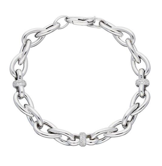Deze zilveren armband bevat ovale schakels en schitterende zirconia discs. Met een lengte van 19 cm voegt dit sieraad verfijning toe aan elke outfit. Het is ideaal om te dragen als solo-statementstuk of in combinatie met andere armbanden voor een gelaagd effect. Perfect voor zowel dagelijks gebruik als speciale gelegenheden.