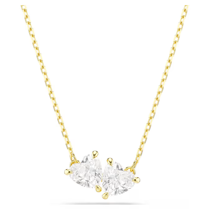 Deze Swarovski-ketting uit de Mesmera-lijn biedt een klassiek ontwerp met een moderne twist. Het ontwerp met prachtige Swarovski Zirkonia in de vorm van twee hartjes wordt gecomplementeerd door een goudkleurige toplaag en de subtiele elegantie van de ketting. Deze charmante ketting is het perfecte romantische cadeau voor een geliefde.