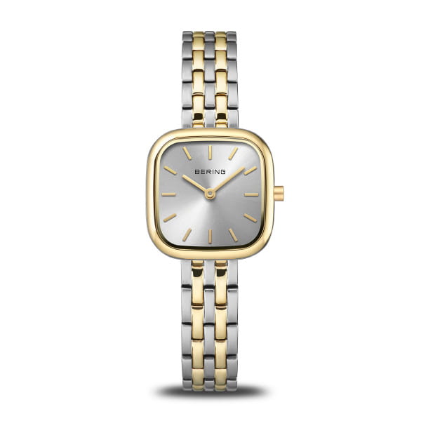  Met zijn heldere, vrouwelijke lijnen en zacht afgeronde vierkante kast belichaamt dit BERING-horloge de essentie van Scandinavische eenvoud &ndash; verfijnd met een vleugje goud. Het tweekleurige ontwerp van geborsteld roestvrij staal, in een combinatie van zilver en goud, verenigt klassieke elegantie met modern minimalisme en maakt het tot een stijlvolle metgezel voor elk moment.  De zilverkleurige wijzerplaat heeft een subtiele sunray-afwerking en laat de goudkleurige uurmarkeringen en wijzers op elegante wijze tot hun recht komen. Plat, krasbestendig saffierglas beschermt de schoonheid van het horloge langdurig. Een bijzonder verfijnd detail is de schakelband, die de bicolor-look voortzet met afwisselend geborstelde en gepolijste elementen &ndash; voor een harmonieuze uitstraling en aangenaam draagcomfort.  Een nauwkeurig quartz uurwerk zorgt voor betrouwbare tijdweergave, terwijl de vouwsluiting een veilige pasvorm garandeert. Dankzij de waterbestendigheid tot 3 ATM is het horloge beschermd tegen alledaagse spatjes. 