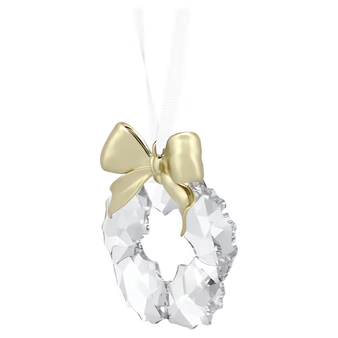 Deze luxueuze kransdecoratie is een tijdloos symbool van eindejaarselegantie. De kristallen creatie hangt aan een wit ripsband lint en heeft 108 lichtreflecterende facetten, samen met een glanzende strik van champagnegoudkleurig metaal. Hang het op een prominente plek op om gevoelens van vreugde en feestelijkheid op te roepen. Decoratieobject. Geen speelgoed. Niet geschikt voor kinderen jonger dan 15 jaar