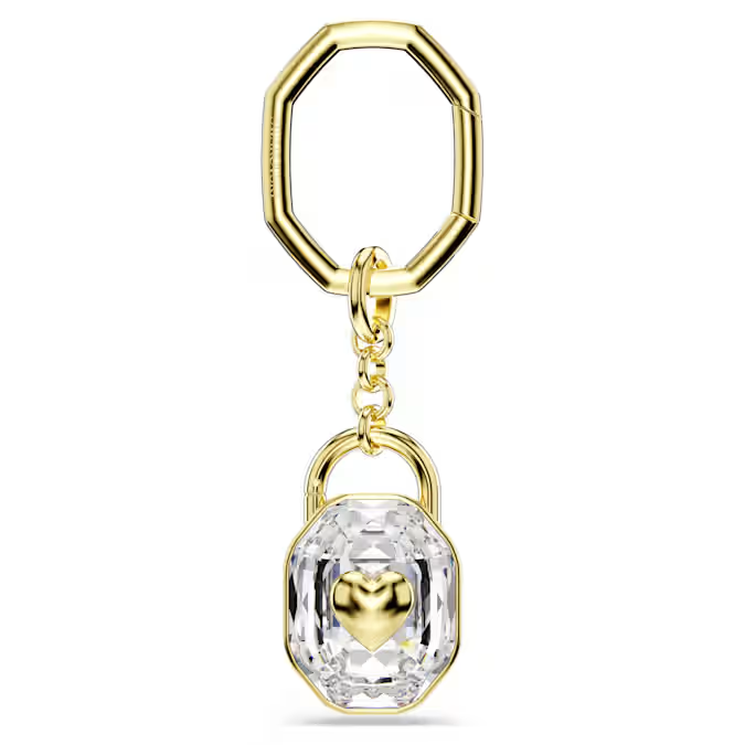 Deze sleutelhanger, vervaardigd in de vorm van een hangslot met goudkleurige toplaag, symboliseert onuitputtelijke liefde en onwrikbare vriendschap. Het luxueuze ontwerp heeft een achthoekige schakel, verbonden met een groot helder kristal met een hart in het midden. Geef deze sleutelhanger cadeau aan een speciaal iemand om uw ware gevoelens te uiten.