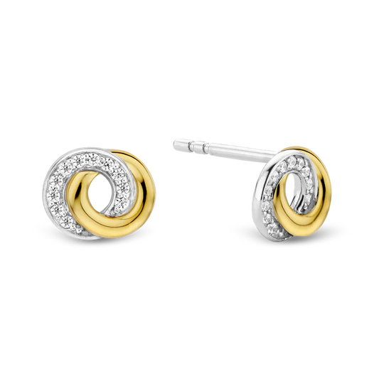 Ontdek de tijdloze aantrekkingskracht van deze TI SENTO vergulde zilveren Infinity Stud Oorbellen 7784ZY. Gemaakt van 925 sterling zilver en verguld met platina voor een blijvende glans, zijn deze oorbellen voorzien van twee met elkaar verbonden cirkels, die de oneindige mogelijkheden van het leven symboliseren. Eén cirkel is verguld met stralend geelgoud, wat zorgt voor een opvallend contrast met de fonkelende pavé van witte cubic zirconia-stenen die een vleugje sprankeling toevoegen. Dit paar studs is een eerbetoon aan de kunst van fijne sieraden en biedt een harmonieuze mix van traditie en moderniteit. Het infinity-symbool, een tijdloze representatie van eindeloos potentieel, voegt een vleugje inspiratie en elegantie toe aan je oren. Verhoog je look met deze verfijnde stukken. Draag ze alleen voor een minimalistisch statement of combineer ze met andere TI SENTO oorbellen voor een gepersonaliseerde touch die zelfvertrouwen en aantrekkingskracht uitstraalt. Zorgvuldig vervaardigd voor de gevoelige huid, is deze nikkelvrije en hypoallergene ring ontworpen voor langdurig comfort en kwaliteit.