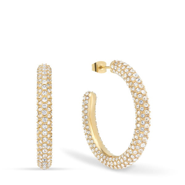  Een sprankelend statement voor zelfverzekerde looks - deze grote pav&eacute; hoepeloorbellen uit de Arctic Pav&eacute; Collection brengen maximale schittering in je oor. Met een diameter van 40 mm zijn ze een echte blikvanger en focussen ze op pure uitstraling: honderden fijngeslepen kristallen glasstenen in elegant wit sieren het oppervlak van de glanzend gouden pav&eacute;-stijl roestvrijstalen ring en zorgen voor een luxueuze schittering bij elke beweging.  Het elegante ontwerp combineert Scandinavische ingetogenheid met glamoureuze aantrekkingskracht - perfect voor speciale gelegenheden of om je alledaagse look een glamoureuze upgrade te geven. 