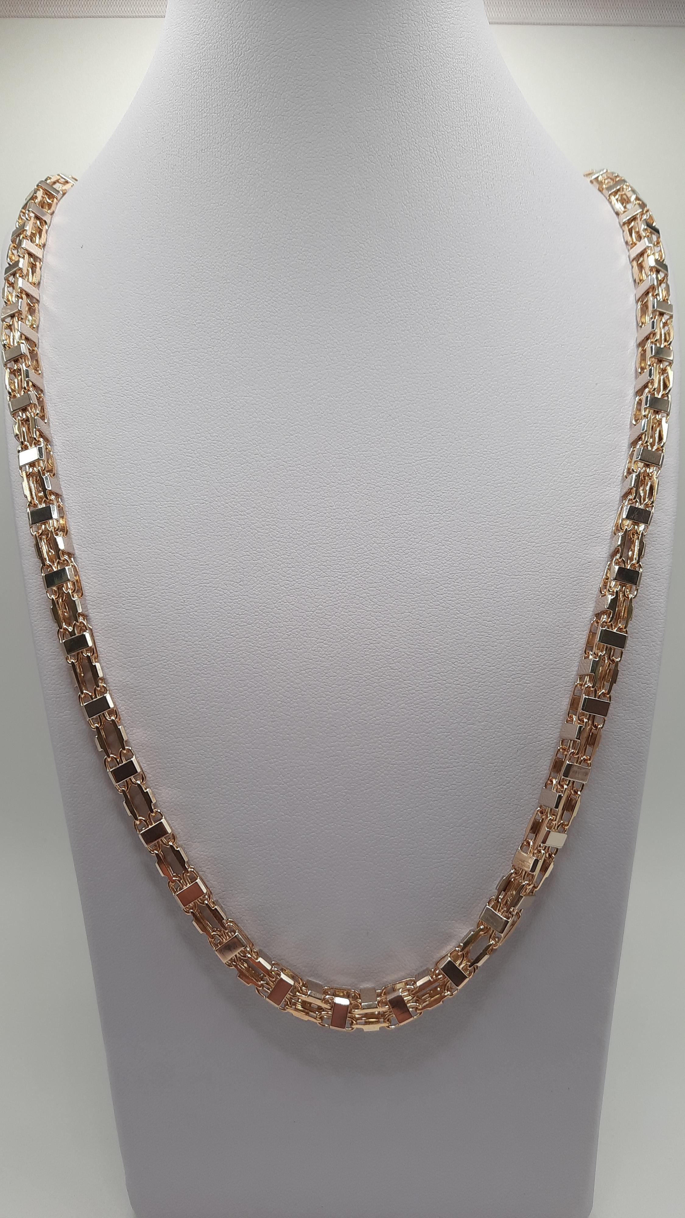 De Gouden Magnum Ketting 14kt, modelnummer BREA-JOY-0002915, is een schitterende gouden ketting met een breedte van 6 mm en een lengte van 660 mm. Met een gewicht van 78,2 gram en een glanzende 14-karaats afwerking, straalt deze ketting luxe uit. Perfect om solo te dragen of te combineren met andere sieraden voor een verfijnde look.