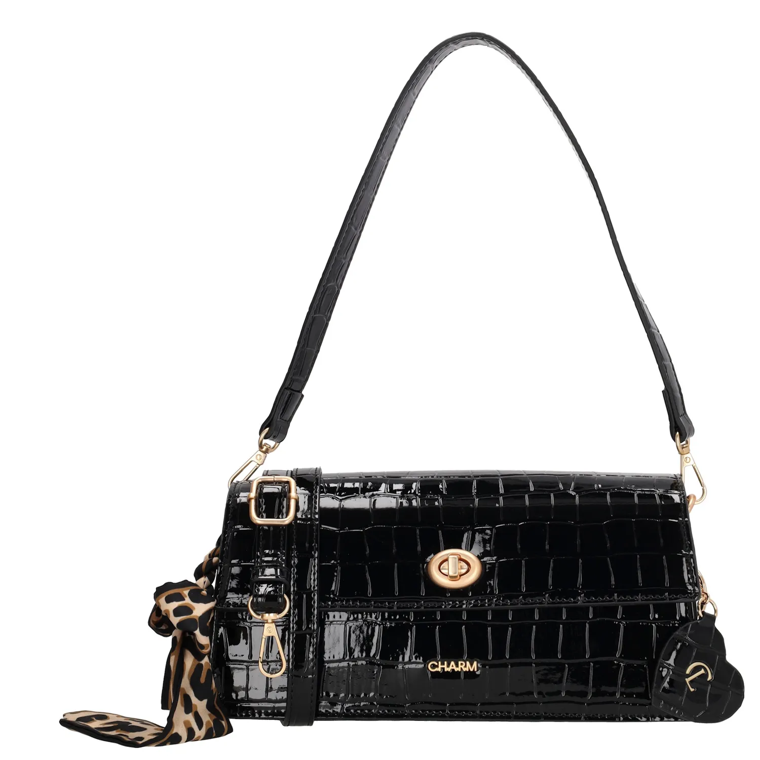 De Charm London Knightsbridge Schoudertas is een elegante eyecatcher met een stijlvolle croco laklook. Deze tas combineert een chique uitstraling met praktische details, perfect voor een avondje uit of een bijzondere gelegenheid.

De tas sluit met een ritssluiting en een overslag met kliksluiting voor extra veiligheid. Aan de binnenkant vind je een ritsvak en een telefoonvak, zodat je je essentials georganiseerd kunt opbergen. De afneembare en verstelbare schouderband zorgt ervoor dat je de tas zowel over de schouder als crossbody kunt dragen.

Als extra detail is de tas voorzien van een charmante sleutelhanger in de vorm van een hartje met spiegeltje én een speels sjaaltje.

Kenmerken:


Croco laklook met overslag en kliksluiting

Ritssluiting voor extra veiligheid

Ritsvak en telefoonvak aan de binnenkant

Afneembare en verstelbare schouderband

Hartvormige sleutelhanger met spiegel

Voorzien van een decoratief sjaaltje