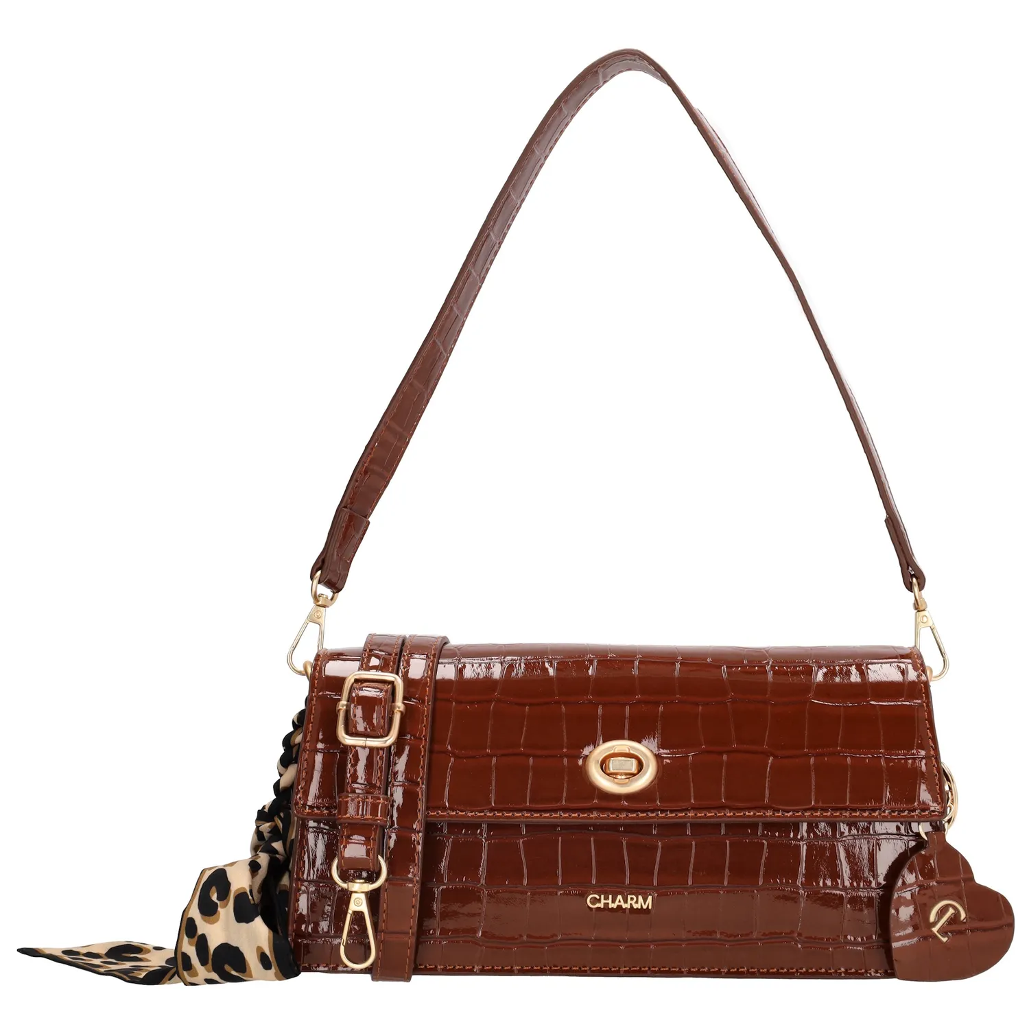 De Charm London Knightsbridge Schoudertas is een elegante eyecatcher met een stijlvolle croco laklook. Deze tas combineert een chique uitstraling met praktische details, perfect voor een avondje uit of een bijzondere gelegenheid.

De tas sluit met een ritssluiting en een overslag met kliksluiting voor extra veiligheid. Aan de binnenkant vind je een ritsvak en een telefoonvak, zodat je je essentials georganiseerd kunt opbergen. De afneembare en verstelbare schouderband zorgt ervoor dat je de tas zowel over de schouder als crossbody kunt dragen.

Als extra detail is de tas voorzien van een charmante sleutelhanger in de vorm van een hartje met spiegeltje én een speels sjaaltje.

Kenmerken:


Croco laklook met overslag en kliksluiting

Ritssluiting voor extra veiligheid

Ritsvak en telefoonvak aan de binnenkant

Afneembare en verstelbare schouderband

Hartvormige sleutelhanger met spiegel

Voorzien van een decoratief sjaaltje