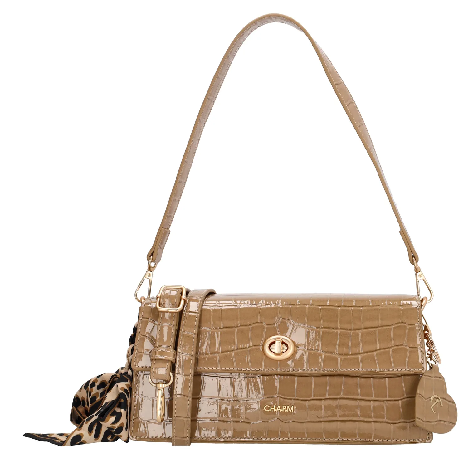 De Charm London Knightsbridge Schoudertas is een elegante eyecatcher met een stijlvolle croco laklook. Deze tas combineert een chique uitstraling met praktische details, perfect voor een avondje uit of een bijzondere gelegenheid.

De tas sluit met een ritssluiting en een overslag met kliksluiting voor extra veiligheid. Aan de binnenkant vind je een ritsvak en een telefoonvak, zodat je je essentials georganiseerd kunt opbergen. De afneembare en verstelbare schouderband zorgt ervoor dat je de tas zowel over de schouder als crossbody kunt dragen.

Als extra detail is de tas voorzien van een charmante sleutelhanger in de vorm van een hartje met spiegeltje én een speels sjaaltje.

Kenmerken:


Croco laklook met overslag en kliksluiting

Ritssluiting voor extra veiligheid

Ritsvak en telefoonvak aan de binnenkant

Afneembare en verstelbare schouderband

Hartvormige sleutelhanger met spiegel

Voorzien van een decoratief sjaaltje