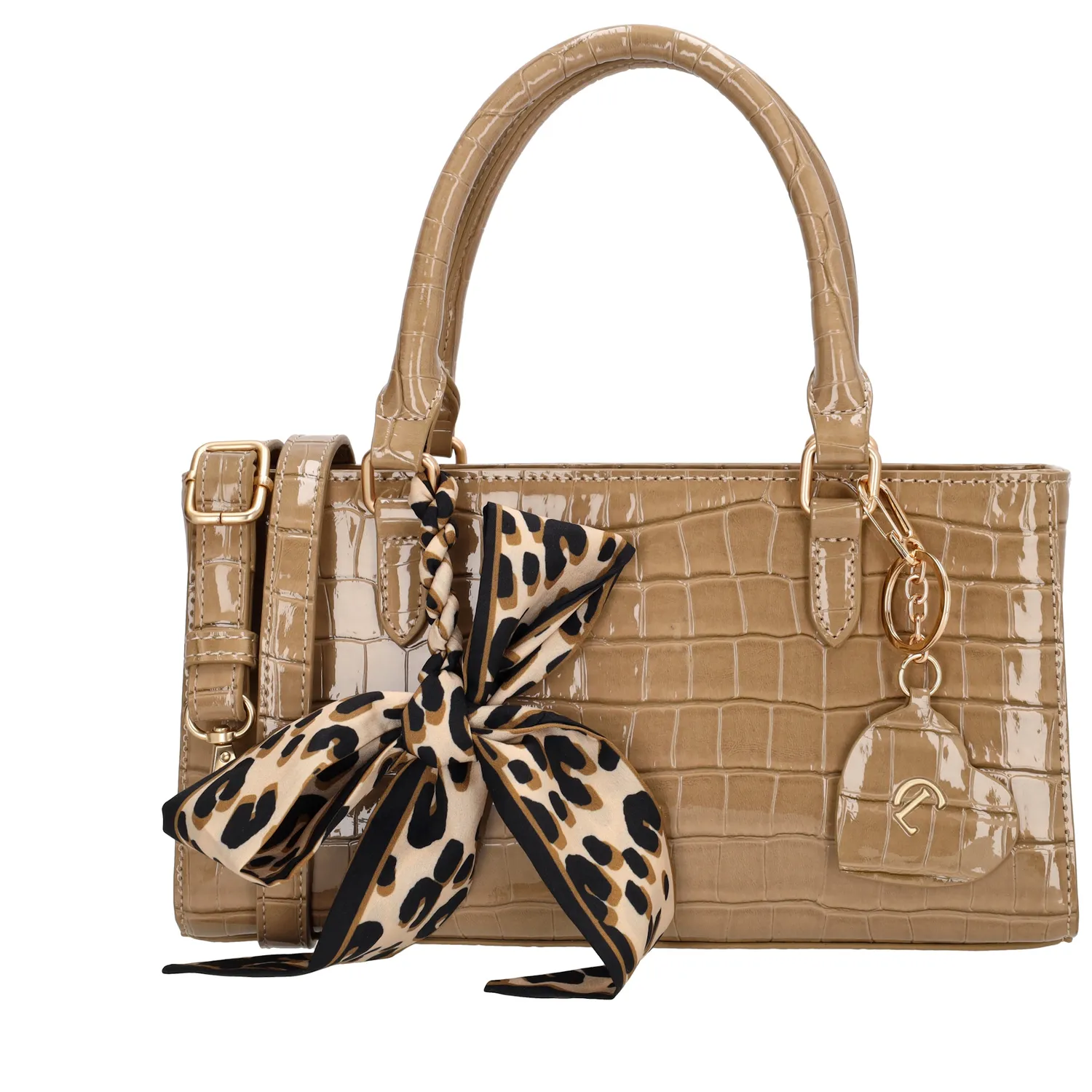 De Charm London Knightsbridge Handtas is een elegante tas met een stijlvolle croco laklook. Dankzij de dubbele handvatten draag je deze tas comfortabel in de hand of over de arm – perfect voor een dagje uit of een chique gelegenheid.

De tas sluit veilig met een ritssluiting en biedt binnenin een praktisch ritsvak en een telefoonvak, zodat je je essentials netjes kunt organiseren. De glanzende goudkleurige details geven de tas een luxueuze uitstraling.

Als speels detail is de tas afgewerkt met een hartvormige sleutelhanger met spiegeltje en een decoratief sjaaltje dat op meerdere manieren te dragen is.

Kenmerken:


Croco laklook

Ritssluiting

Ritsvak en telefoonvak aan de binnenkant

Dubbele handvatten

Verstelbare en afneembare schouderband

Hartvormige sleutelhanger met spiegel

Inclusief decoratief sjaaltje