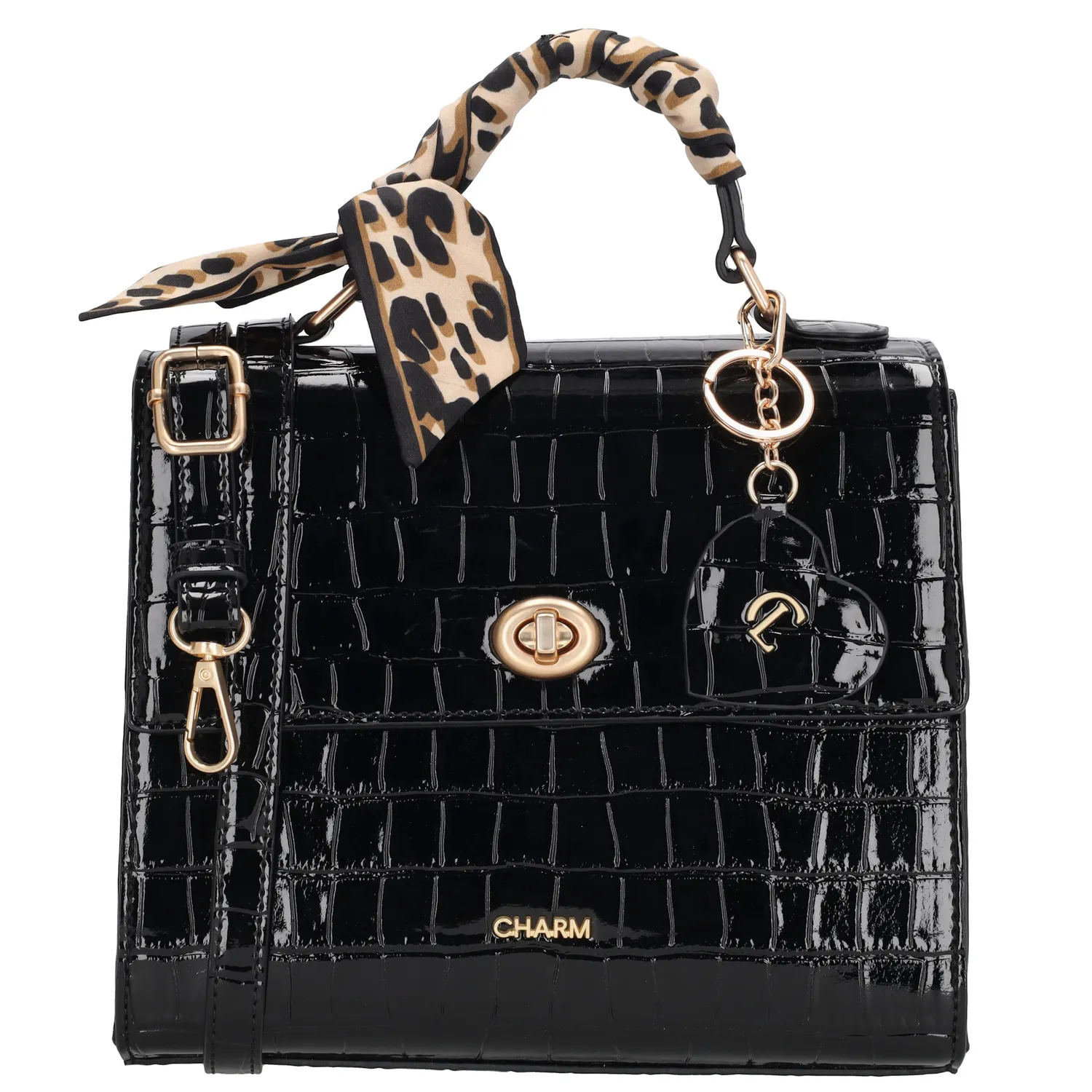 De Charm London Knightsbridge Handtas is een stijlvolle handtas met een glanzende croco laklook en verfijnde details. Dankzij het compacte ontwerp en de elegante afwerking is deze tas perfect voor een dagje uit of een diner in stijl.

De tas sluit met een ritssluiting en een overslag met kliksluiting, zodat je spullen veilig opgeborgen zijn. Aan de binnenkant vind je een ritsvak en een telefoonvak om alles overzichtelijk mee te nemen. Het handvat ligt prettig in de hand en geeft de tas een klassieke uitstraling.

Als speelse touch is de tas afgewerkt met een hartvormige sleutelhanger met spiegeltje en een decoratief sjaaltje dat je op meerdere manieren kunt dragen.

Kenmerken:

Croco laklook met overslag en kliksluiting

Ritssluiting voor extra veiligheid

Ritsvak en telefoonvak aan de binnenkant

Stevig handvat

Hartvormige sleutelhanger met spiegel

Inclusief sjaaltje, op verschillende manieren te dragen