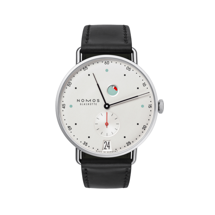 Metro date power reserve, designed by Mark Braun, is young and sophisticated, yet Glashütte through and through. The power reserve indicator doesn’t only remind wearers when to rewind, it is also one of the design features. Others include hands as fine as quill tips and colorful hour indexes. And the hand-wound NOMOS caliber DUW 4401 is within, setting the pace, equipped with our proprietary escapement