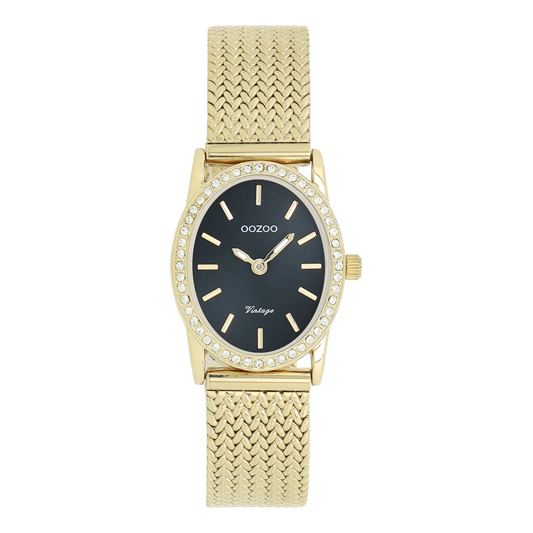 De klassieke look blijft centraal staan ​​in deze trendy serie en daarom is dit ovale OOZOO vintage design met een speelse knipoog dé must-have van het seizoen! Dit dameshorloge combineert mode en comfort met een 28x23 mm goudkleurige metalen kast met kristallen en een donkergroene sunray wijzerplaat. De goudkleurige metalen V-mesh band maakt dit horloge tot een trendy accessoire dat je elke dag kunt dragen. De wijzerplaat heeft goudkleurige streepjescijfers en bijpassende wijzers. Het C20434-horloge geeft je outfit een sprankeling. Het mineraalglas ligt in een mm dunne metalen horlogekast met IP-coating. Dit design heeft een roestvrijstalen achterplaat en is nikkelvrij. Dit horloge heeft een 2ATM Japans uurwerk en wordt geleverd met 2 jaar garantie
