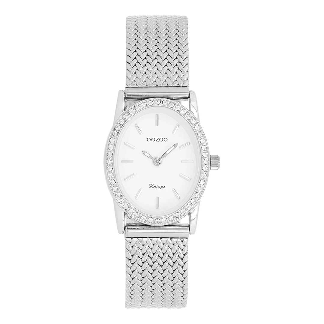 De klassieke look blijft centraal staan ​​in deze trendy serie en daarom is dit ovale OOZOO vintage design met een speelse knipoog dé must-have van het seizoen! Dit dameshorloge combineert mode en comfort met een 28x23 mm zilverkleurige metalen horlogekast met kristallen en een witte wijzerplaat. De zilverkleurige metalen V-mesh band maakt dit horloge tot een trendy accessoire dat je elke dag kunt dragen. De wijzerplaat heeft zilverkleurige streepjescijfers en bijpassende wijzers. De C20430 geeft je outfit een sprankeling. Het mineraalglas ligt in een mm dunne metalen horlogekast met IP-coating. Dit design heeft een roestvrijstalen achterplaat en is nikkelvrij. Dit horloge heeft een 2ATM Japans uurwerk en wordt geleverd met 2 jaar garantie 