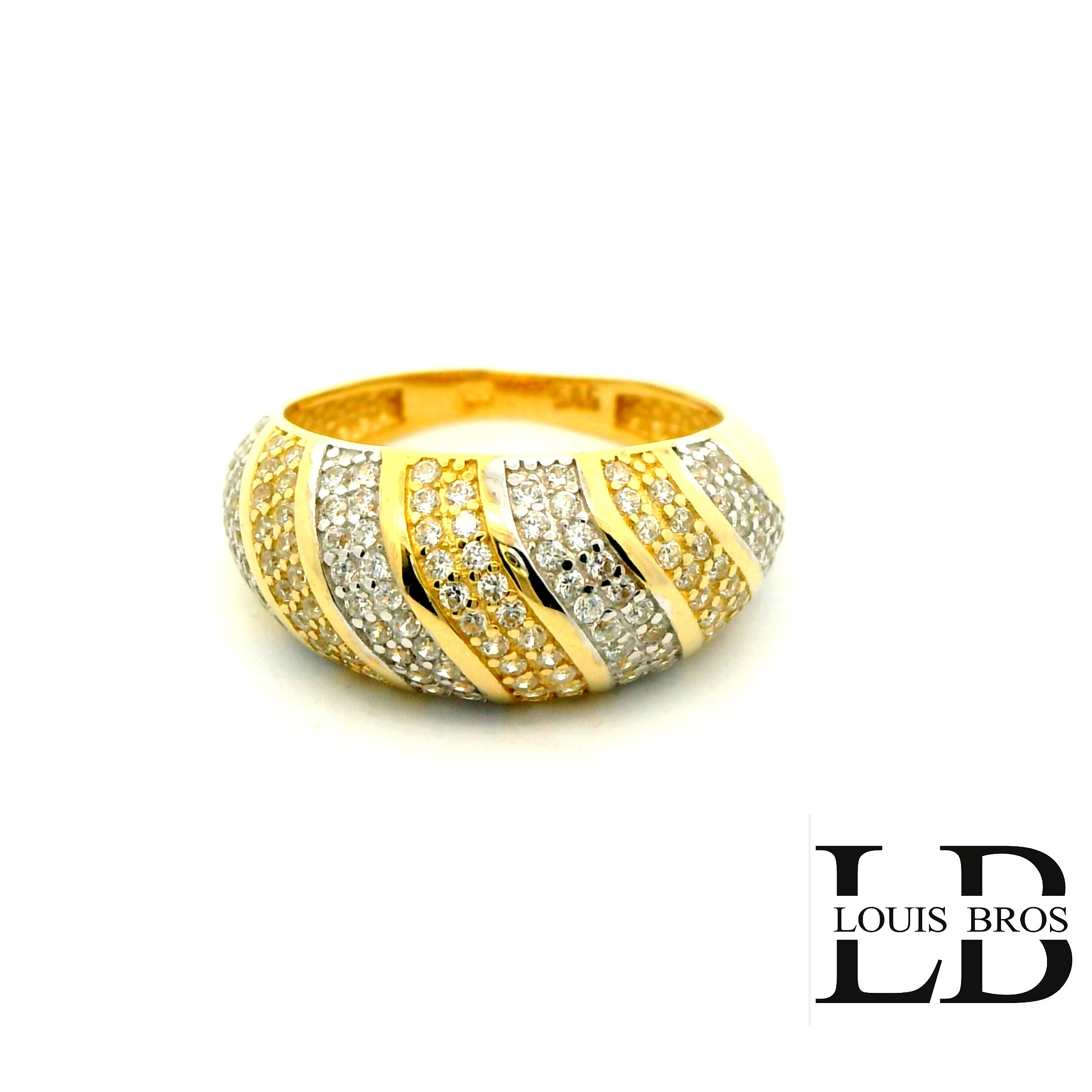 Deze elegante ring is vervaardigd uit 14 karaat bicolor goud (4.64 gr), een stijlvolle combinatie van wit- en geelgoud. Het tijdloze ontwerp wordt verfraaid met sprankelende zirkonia’s, die de ring een luxe en verfijnde uitstraling geven. Dankzij de subtiele glans en het contrasterende kleurenspel van het goud is dit sieraad zowel modern als klassiek, en geschikt voor iedere gelegenheid.

De ring is perfect als cadeau voor een bijzonder moment, maar ook als stijlvolle aanvulling op je dagelijkse look.

Materiaal: 14 karaat goud (bicolor)
Steen: Zirkonia
Stijl: Elegant, tijdloos en veelzijdig.
De ring is verkrijgbaar in meerdere afmetingen.