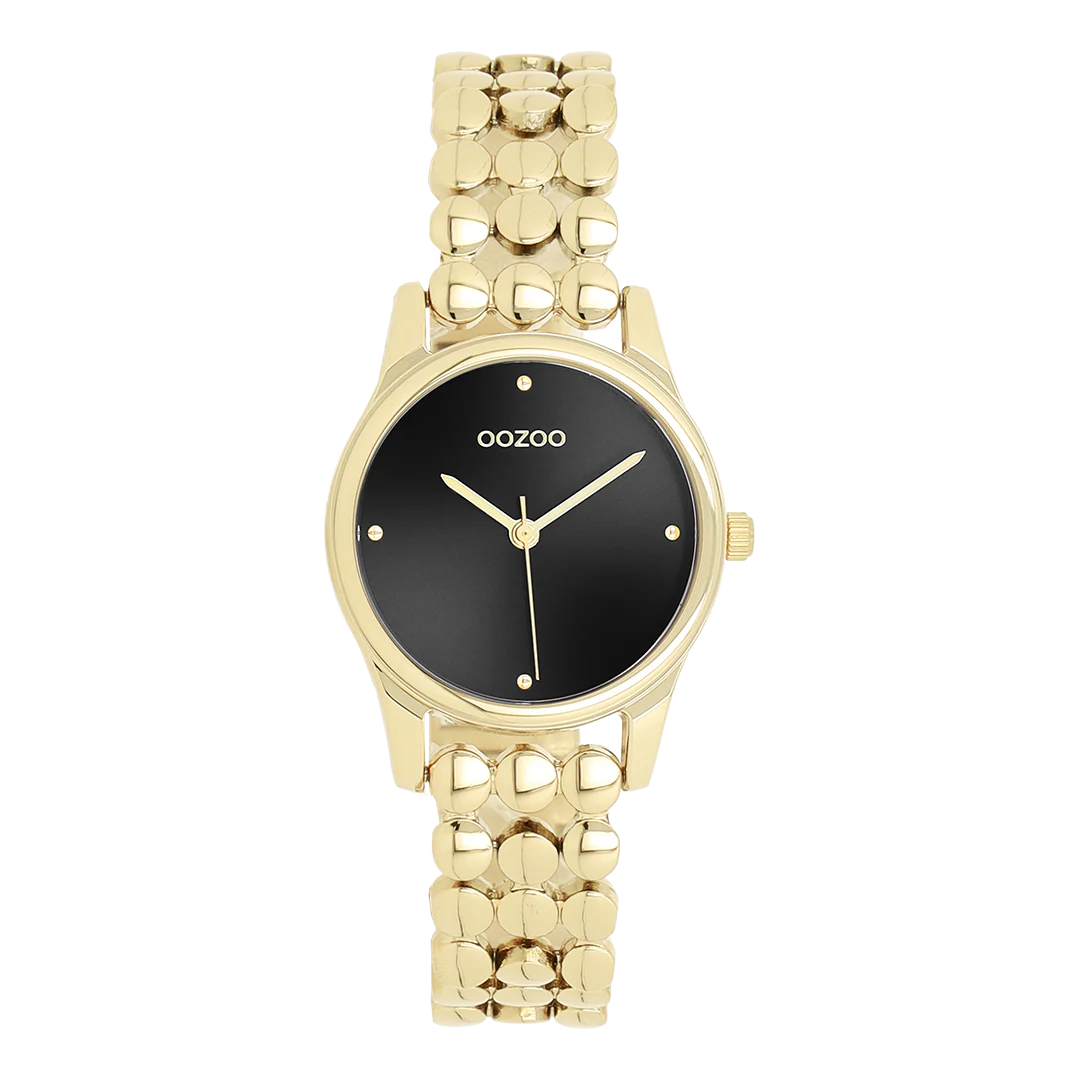 Val op met dit prachtige ronde dameshorloge uit de trendy OOZOO Timepieces-collectie. De C11634 heeft een glanzende goudkleurige schakelband met stippen en een 28 mm goudkleurige metalen horlogekast. Maak een echt fashion statement met deze zwarte sunray wijzerplaat, goudkleurige stippen en bijpassende wijzers. Dit onmisbare horloge voor je garderobe heeft mineraalglas, een roestvrijstalen achterplaat en is nikkelbestendig. Dit horloge heeft een 2ATM Japans uurwerk en wordt geleverd met 2 jaar garantie.