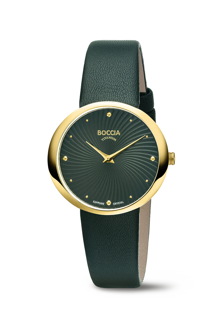 Das seidenmatte Zifferblatt mit dem "Turbinenrad"-Reliefschliff schimmert faszinierend im einfallenden Licht und gibt dieser Uhr eine ganz besondere Note. Ein mit nur 6,5mm sehr flaches, leicht ovales Geh&auml;use (30x32mm) aus antiallergischem Rein-Titan mit gelbgoldfarbener Ionenplattierung und einem absolut kratzfestem Saphirglas, einem hochwertigen Lederband mit Dornschlie&szlig;e machen diese Modellserie einzigartig und bieten ein besonders gutes Preis/Leistungs-Verh&auml;ltnis. Dazu noch die Batterielebensdauer von 4 Jahren, ein Novum bei derartig kleinen Damenuhren!