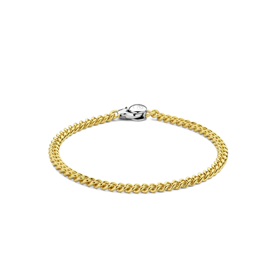 Voeg een vleugje tijdloze elegantie toe met deze TI SENTO vergulde zilveren gourmet armband 23055SY. Gemaakt van 925 sterling zilver en bedekt met glanzend geelgoud, heeft deze curb link armband een betoverende reeks schakels, elk zorgvuldig vervaardigd voor een opvallend effect. Deze armband is een eerbetoon aan de kunst van fijne sieraden, met een harmonieuze mix van traditie en eigentijds design. Het kettingontwerp, een tijdloos symbool van kracht en veerkracht, voegt een vleugje verfijning toe aan elke outfit. Versterk je dagelijkse look met dit iconische stuk. Draag het alleen voor een minimalistische statement of combineer het met andere TI SENTO armbanden voor een persoonlijke touch die zelfvertrouwen en aantrekkingskracht uitstraalt. Met zorg vervaardigd voor gevoelige huid, garandeert deze nikkelvrije en hypoallergene armband blijvend comfort en kwaliteit.

