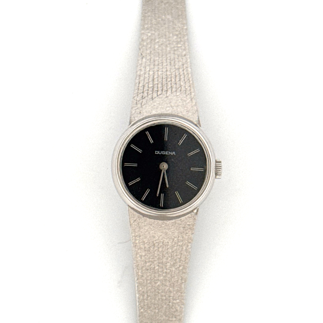 De Dugena Horloge biedt een verfijnde stijl met een 14-karaats witgouden kast en een echte gouden zilverkleurige band. Met een ronde kast van 7 mm dikte straalt deze polshorloge elegantie uit. Hoewel er geen datumfunctie is, maakt het minimalistische ontwerp het ideaal voor formele gelegenheden. Draag deze horloge bij luxe outfits voor een klassieke uitstraling.