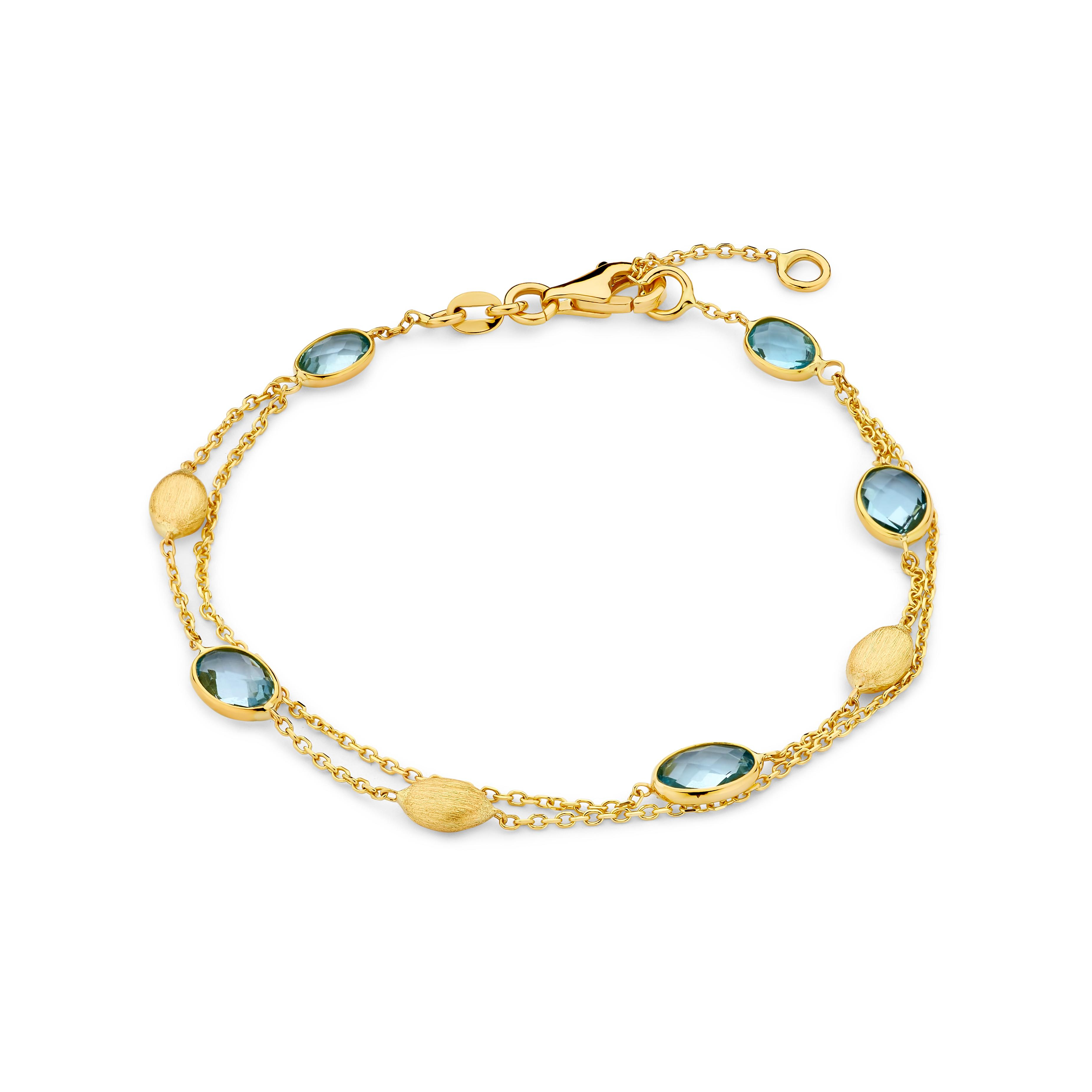 Gouden 18 karaat armband met blauwe topaas 