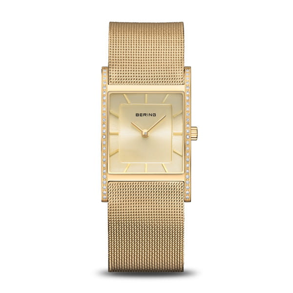  Een gouden statement van elegantie – de BERING 10426-333-S combineert minimalistisch design met stralende verfijning in perfecte harmonie.  De rechthoekige kast geeft dit dameshorloge een eigentijdse uitstraling, terwijl de gouden sunray-wijzerplaat een gevoel van arctische helderheid en rust oproept. Subtiele glinsterende steentjes omlijsten de kast, als zonlicht dat weerkaatst op ijs.  De goudkleurige Milanese band sluit soepel om de pols en biedt dankzij de vouwsluiting comfortabel en veilig draagplezier. Binnenin zorgt een nauwkeurig kwartsuurwerk voor betrouwbare tijdweergave, beschermd door krasbestendig saffierglas.  Met een breedte van 26 mm, een lengte van 38 mm en een waterdichtheid tot 5 ATM is dit horloge de perfecte mix van stijl en functionaliteit. Een tijdloos accessoire dat trends overstijgt.  Een gouden moment om je pols – voor vrouwen die de tijdloze schoonheid van het noordpoolgebied op hun eigen manier uitdrukken. 
