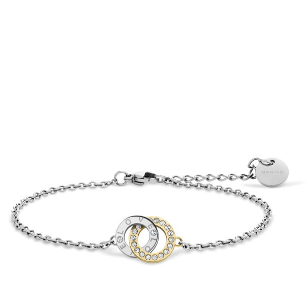 De BERING armband 660-127-X0 combineert symboliek en elegantie in een verfijnd bicolor ontwerp. Twee verweven ringen &ndash; &eacute;&eacute;n zilverkleurig met de gravure &ldquo;LOVE&rdquo; en &eacute;&eacute;n goudkleurig met fonkelende steentjes &ndash; staan voor een band die blijft. De combinatie van gepolijst staal in twee tinten geeft het ontwerp een moderne, betekenisvolle uitstraling.  De fijne schakelketting met veilige sluiting en BERING-hanger maken het geheel compleet. Als onderdeel van de 15th Anniversary-collectie viert dit sieraad wat telt: liefde, verbinding en tijdloze schoonheid.  Gemaakt van zilver- en goudkleurig roestvrij staal met sprankelende steentjes. 
