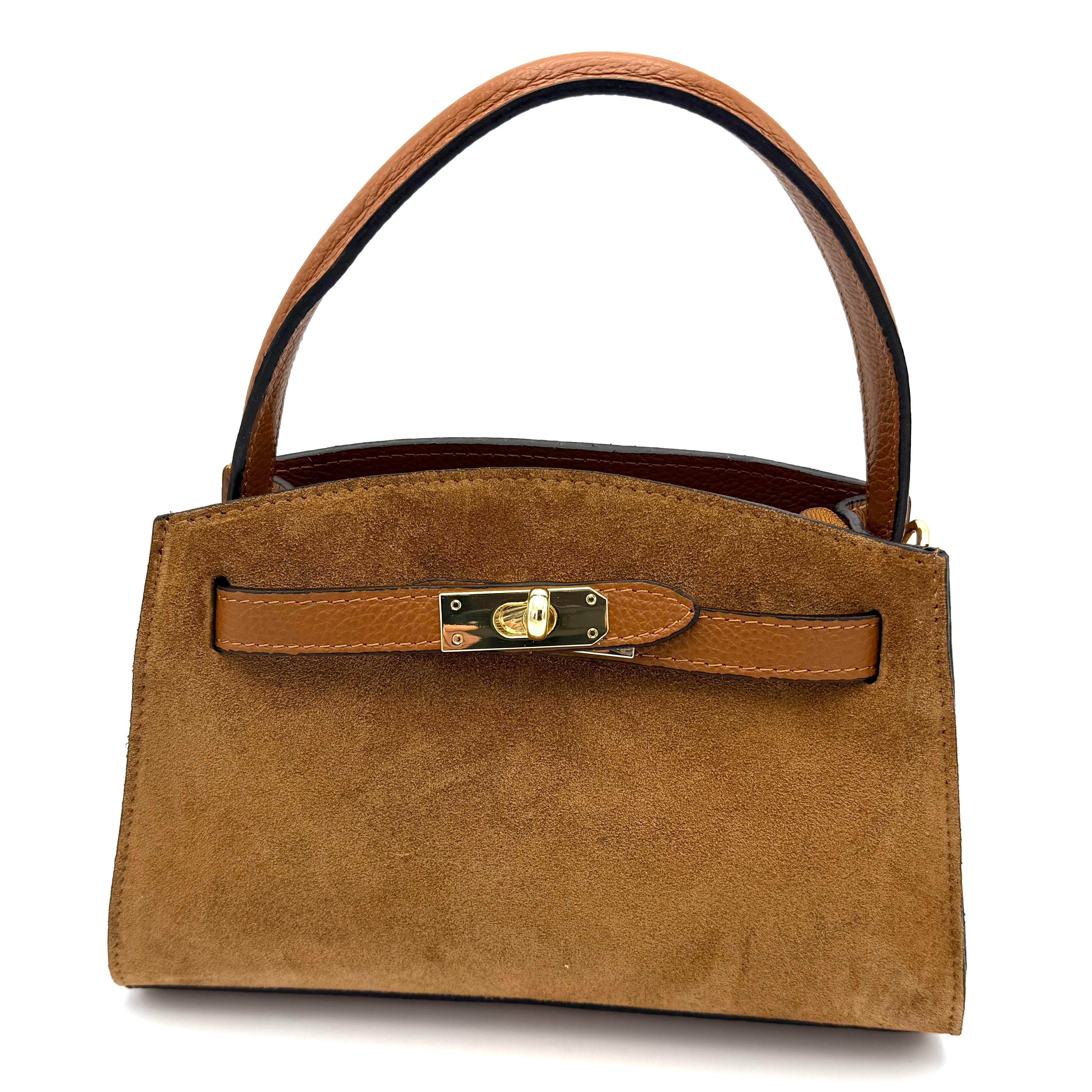 Leren Handtas met Suède Handgreep – Gemaakt in Italië

Ontdek pure elegantie met deze Italiaanse handtas van soepel dollaro leer, verfijnd afgewerkt met een luxueuze suède handgreep. Compact, stijlvol en praktisch – de ideale tas voor elke dag of een avond uit.

De tas is voorzien van een lange, afneembare en verstelbare schouderriem, zodat je haar zowel in de hand, op de schouder als crossbody kunt dragen. De toprits biedt veilige sluiting, en daaronder bevindt zich één overzichtelijk hoofdvak voor je dagelijkse essentials.

De voetjes aan de onderkant beschermen het leer tegen krassen en houden de tas mooi in vorm. Dankzij het tijdloze ontwerp en de combinatie van suède en dollaro leer straalt deze tas Italiaanse klasse uit bij elke gelegenheid.

Afmetingen:
Hoogte: 16 cm • Breedte: 25 cm • Diepte: 11 cm

Kenmerken:

Gemaakt in Italië van hoogwaardig dollaro leer

Luxe suède handgreep voor extra comfort en stijl

Lange, afneembare en verstelbare schouderriem

Toprits met extra ritssluiting voor veiligheid

Eén ruim hoofdvak

Beschermende voetjes aan de onderzijde

Compact en elegant ontwerp

Waarom je deze tas wilt:
Deze Italiaanse leren handtas combineert verfijnde elegantie met dagelijks gemak. Het hoogwaardige leer, de suède accenten en de praktische indeling maken dit een tijdloze favoriet die moeiteloos bij elke outfit past.
