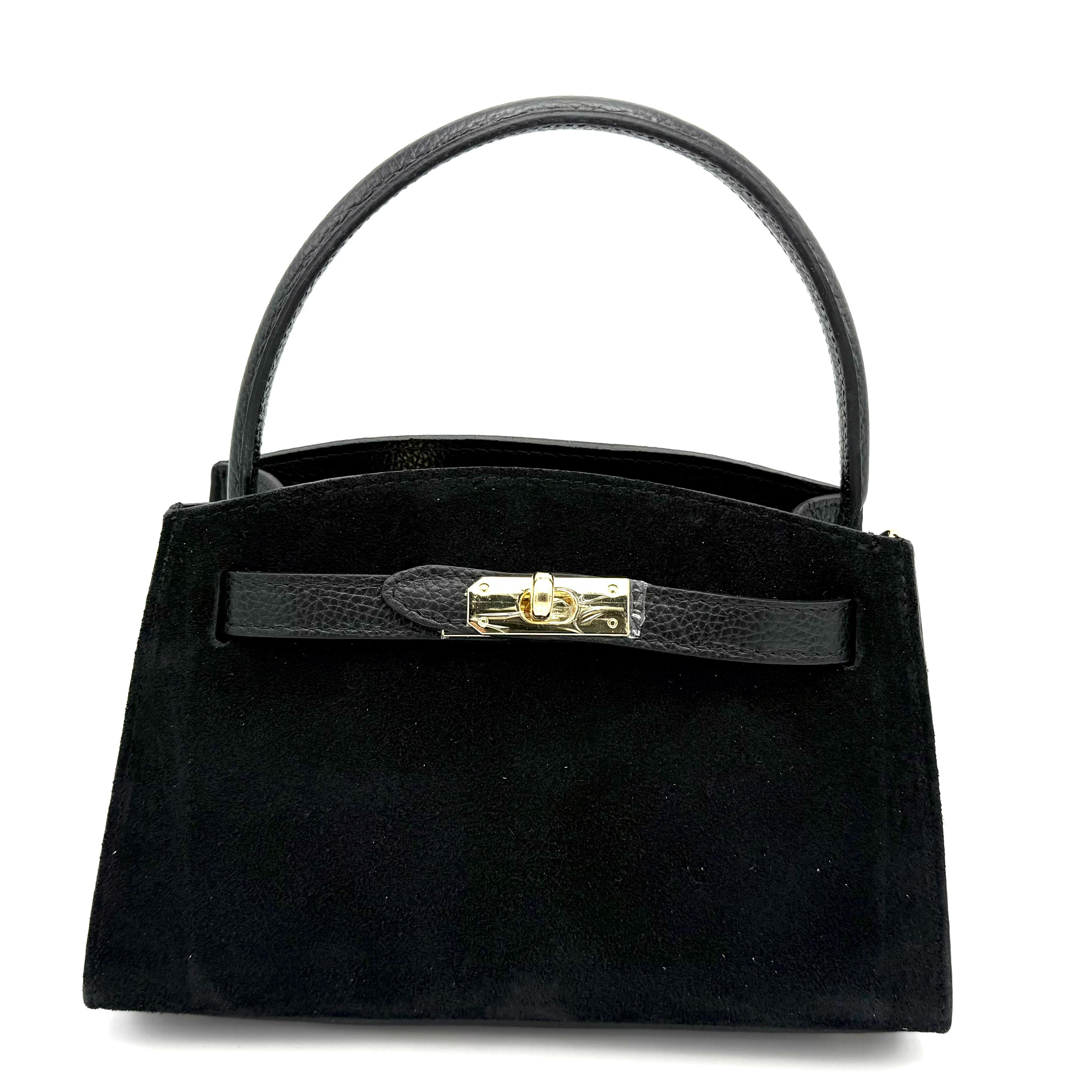 Leren Handtas met Suède Handgreep – Gemaakt in Italië

Ontdek pure elegantie met deze Italiaanse handtas van soepel dollaro leer, verfijnd afgewerkt met een luxueuze suède handgreep. Compact, stijlvol en praktisch – de ideale tas voor elke dag of een avond uit.

De tas is voorzien van een lange, afneembare en verstelbare schouderriem, zodat je haar zowel in de hand, op de schouder als crossbody kunt dragen. De toprits biedt veilige sluiting, en daaronder bevindt zich één overzichtelijk hoofdvak voor je dagelijkse essentials.

De voetjes aan de onderkant beschermen het leer tegen krassen en houden de tas mooi in vorm. Dankzij het tijdloze ontwerp en de combinatie van suède en dollaro leer straalt deze tas Italiaanse klasse uit bij elke gelegenheid.

Afmetingen:
Hoogte: 16 cm • Breedte: 25 cm • Diepte: 11 cm

Kenmerken:

Gemaakt in Italië van hoogwaardig dollaro leer

Luxe suède handgreep voor extra comfort en stijl

Lange, afneembare en verstelbare schouderriem

Toprits met extra ritssluiting voor veiligheid

Eén ruim hoofdvak

Beschermende voetjes aan de onderzijde

Compact en elegant ontwerp

Waarom je deze tas wilt:
Deze Italiaanse leren handtas combineert verfijnde elegantie met dagelijks gemak. Het hoogwaardige leer, de suède accenten en de praktische indeling maken dit een tijdloze favoriet die moeiteloos bij elke outfit past.