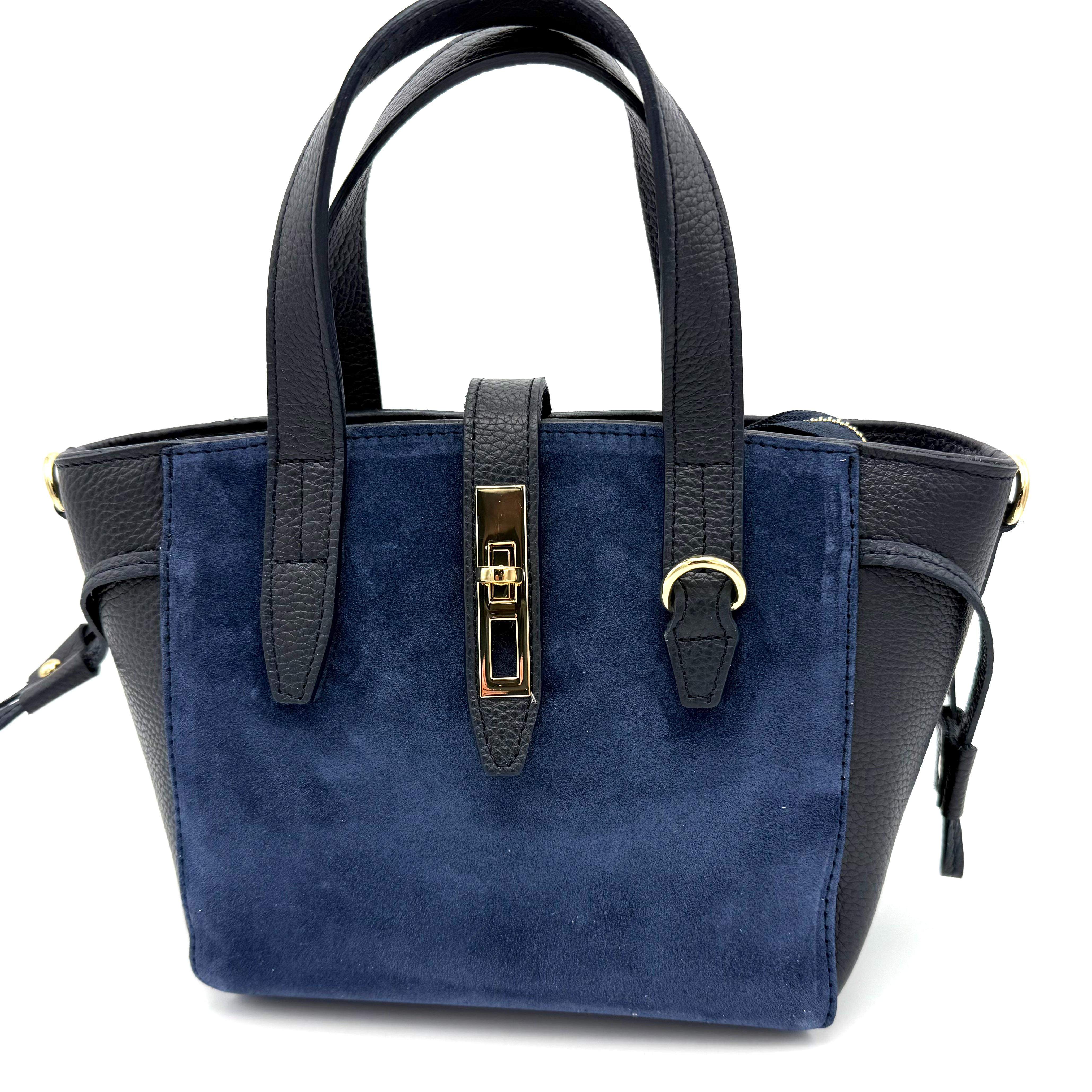 Luxe Italiaanse Handtas van Suède en Dollaro Leer – Elegant & Veilig Design

Ontdek tijdloze elegantie met deze handgemaakte Italiaanse tas, vervaardigd uit een verfijnde combinatie van suède en soepel dollaro leer. Deze tas straalt klasse en vakmanschap uit — een perfecte balans tussen luxe mode en dagelijks gebruiksgemak.

De tas is voorzien van een korte handgreep én een afneembare, verstelbare schouderriem, zodat je haar zowel in de hand, op de schouder als crossbody kunt dragen. De band met draaislot zorgt samen met de extra toprits voor een dubbele sluiting – veilig én stijlvol.

Binnenin vind je één ruim hoofdvak met een achterritsvak en een steekvak, ideaal voor het overzichtelijk opbergen van je essentials. De onderzijde is afgewerkt met beschermende pootjes, die het leer mooi houden en de tas een luxe afwerking geven.

Met haar elegante vorm, rijke materialen en Italiaanse flair is deze tas een echte eyecatcher — perfect voor zowel werk, stadse uitstapjes als avondgelegenheden.

Afmetingen (indien gewenst toe te voegen): Hoogte xx cm • Breedte xx cm • Diepte xx cm

Kenmerken:

Gemaakt in Italië van hoogwaardig dollaro leer en suède

Korte handgreep + afneembare, verstelbare schouderriem

Band met draaislot en extra toprits – extra veilig

Ruim hoofdvak met achterritsvak en steekvak

Beschermende pootjes aan de onderzijde

Elegant, modieus en tijdloos design

Waarom je deze tas wilt:
Deze Italiaanse leren handtas is de perfecte mix van elegantie, functionaliteit en veiligheid. De luxe materialen, het verfijnde ontwerp en de doordachte indeling maken dit een tas die elke outfit compleet maakt.

Afmetingen Hoogte 19cm x breed 21cm x diep 11cm