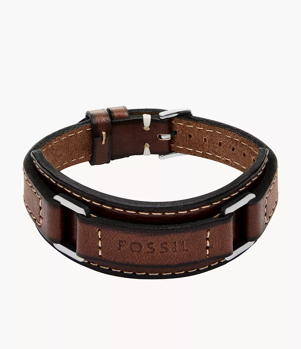 Inspired by classic American machinery, the Machine collection is rugged and built to last. The brown leather strap offers natural texture that develops character over time, and is accented by stainless steel square rings and topstitch detailing. The adjustable buckle ensures a secure, tailored fit. A true statement in industrial-inspired design.