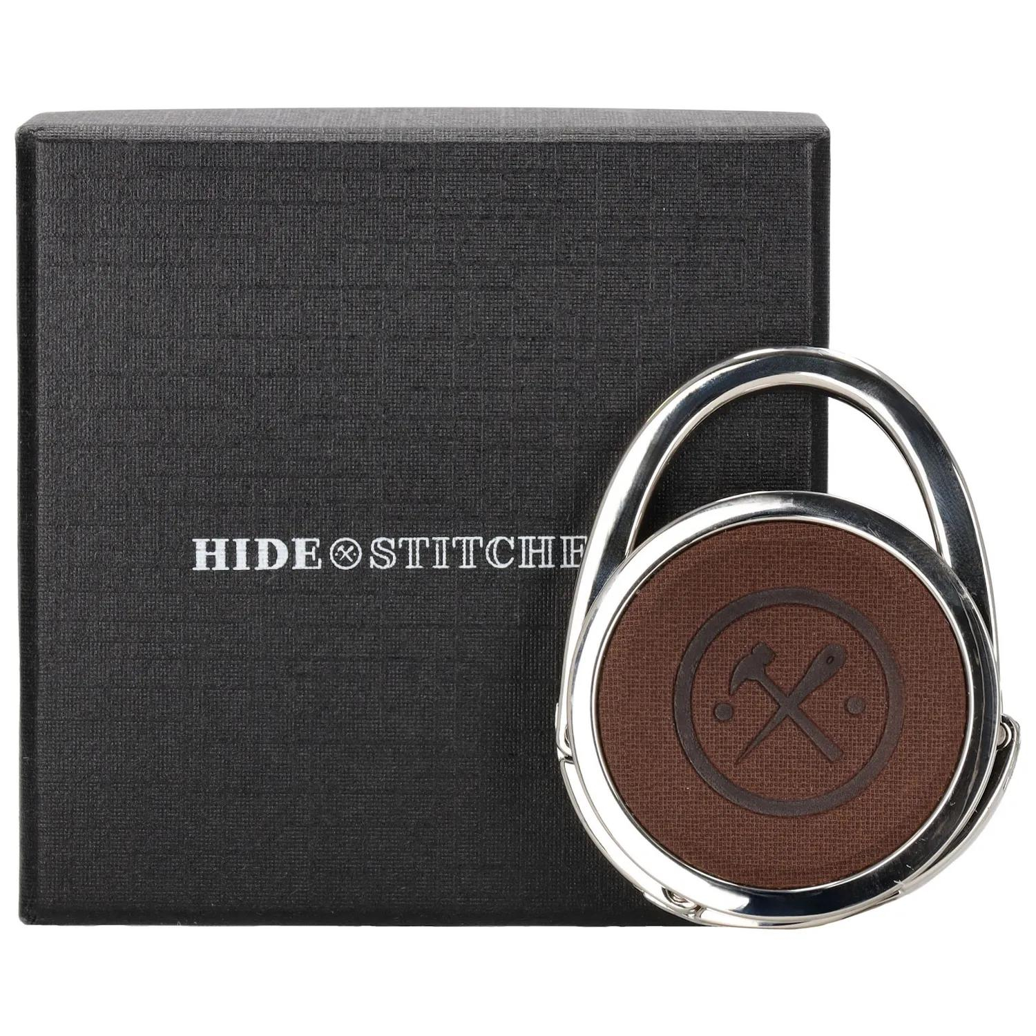 Geen slingerende tas meer met deze Tassenhanger hang jij je tas simpel op aan tafel