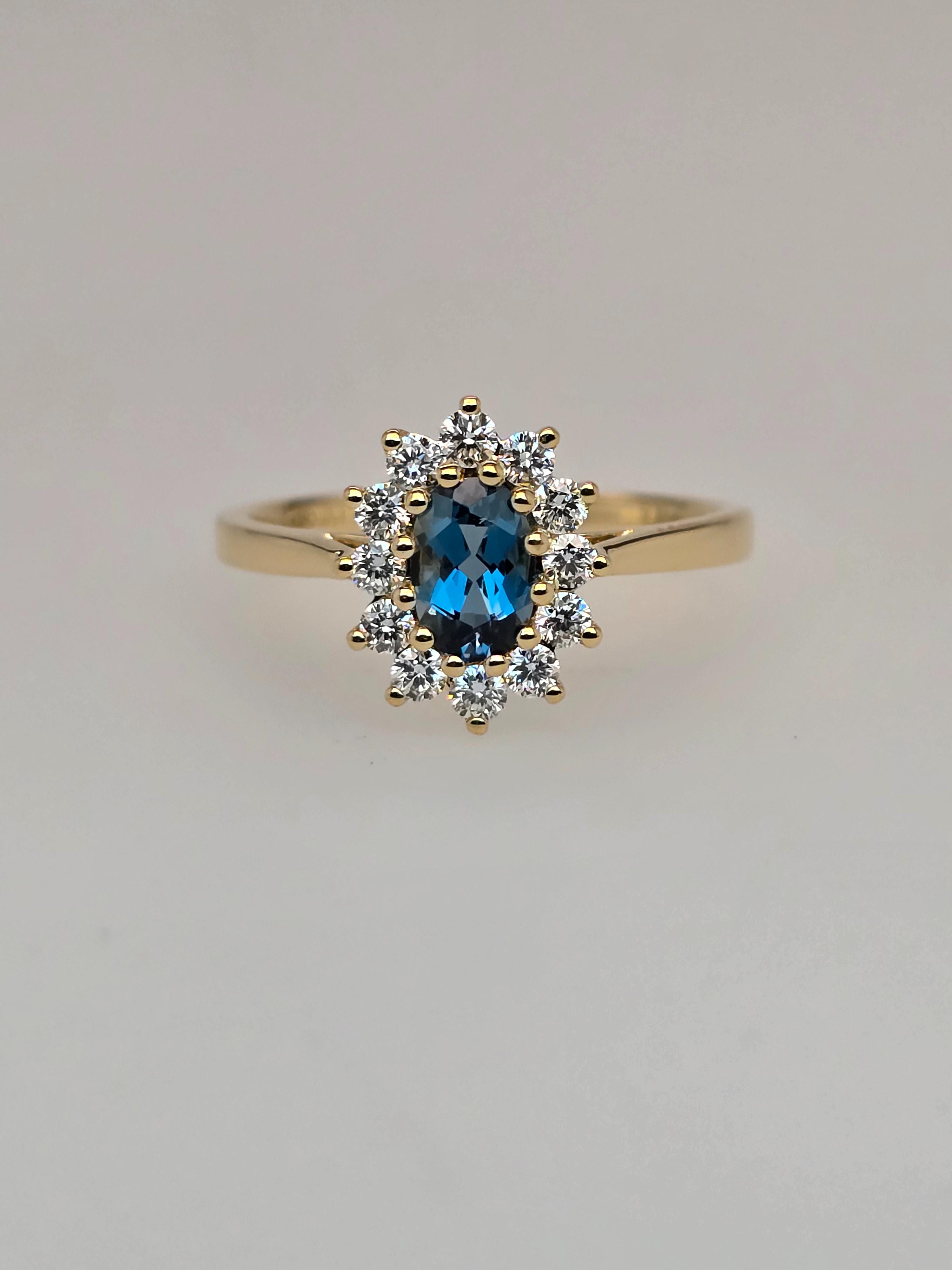 Ring goud 18kt met diamanten en blauwe topaas