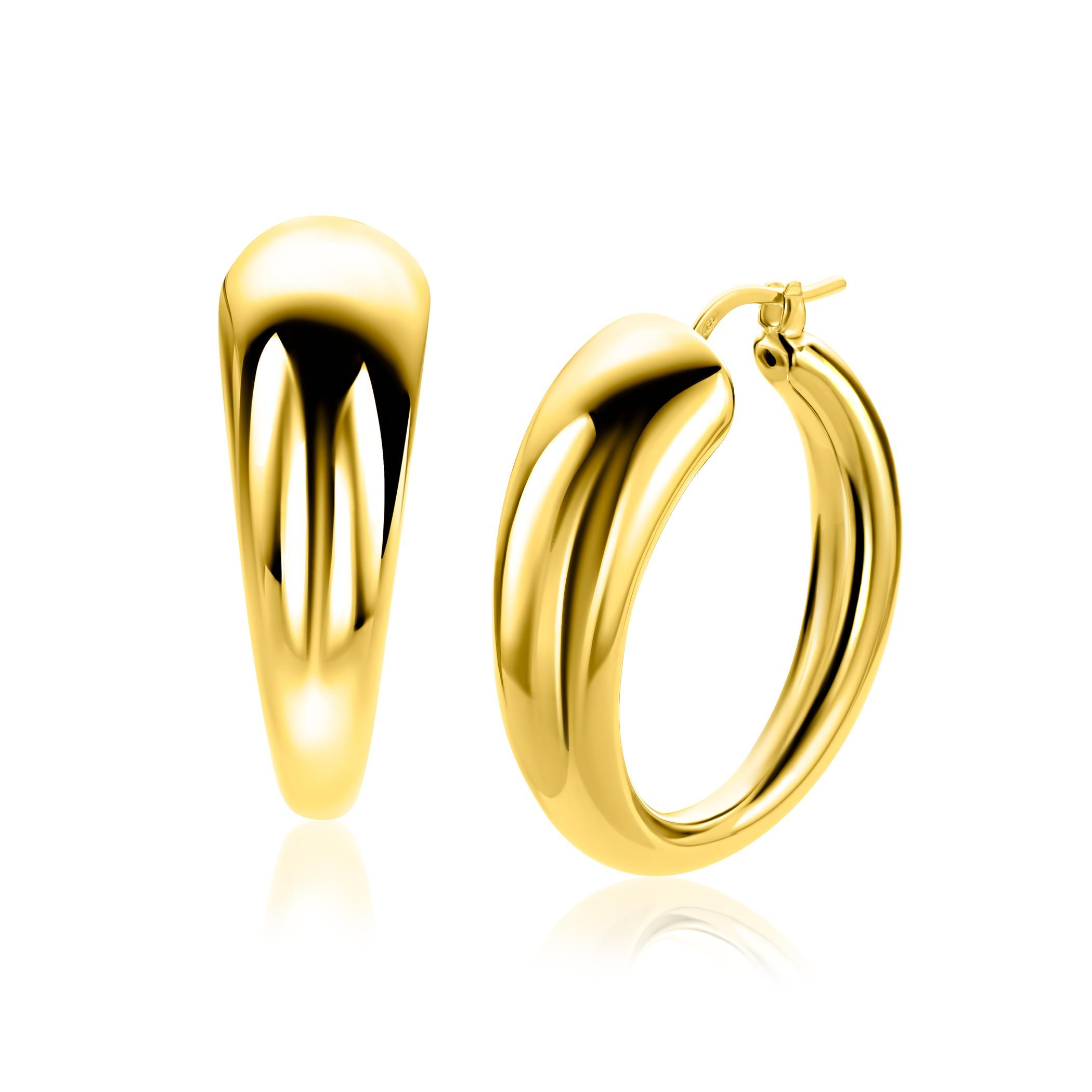 De ZINZI zlv.creolen ZIO2789G zijn elegante creoolse oorbellen van een onbekend merk. Ze zijn vervaardigd uit verguld goud en hebben een afgeronde, bolvormige uitvoering van 32x11 mm. Deze oorbellen zijn perfect te dragen bij zowel formele als informele gelegenheden en voegen een stijlvolle afwerking toe aan elke outfit. Perfect om je look compleet te maken!