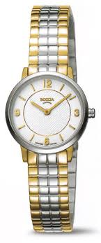 Die DAU Boccia Quarz Bicolor Uhr, Modellnummer 3371-04, besticht durch ein rundes Titangeh&auml;use, Saphirglas und ein zweifarbiges Gold-Silber-Armband. Mit cremefarbenem Streifen-Zifferblatt ohne Datumsfunktion ist sie analog und in Gr&ouml;&szlig;e 25 erh&auml;ltlich. Diese elegante Uhr wird stilvoll am Handgelenk getragen und erg&auml;nzt sowohl formelle als auch l&auml;ssige Outfits perfekt.