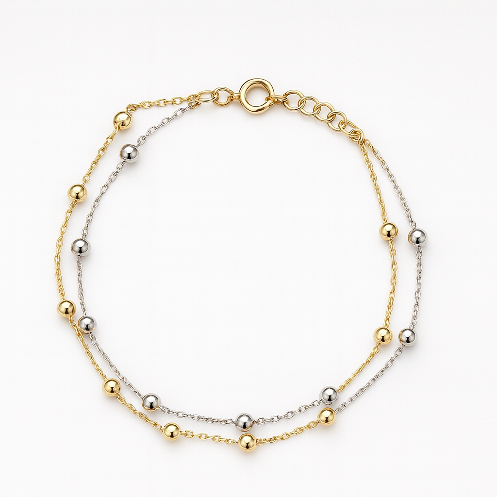 Bicolor gouden armband met bolletjes in een lengte van 19 cm.