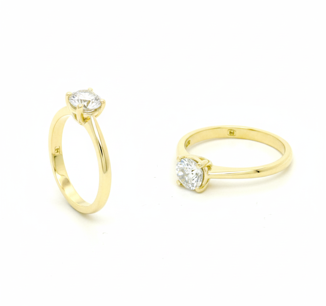 geelgouden verlovingsring met centrale diamant (briljant geslepen) van 0.62ct H/si