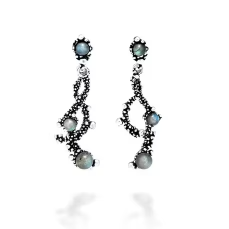 Shine in the darkness like millions of distant little stars. Wear the Milky Way long earrings, which confer movement and light to the face with their curved shape and articulated setting. The Milky Way collection evokes emotions that only the beauty of handcrafted burnished silver can provide.