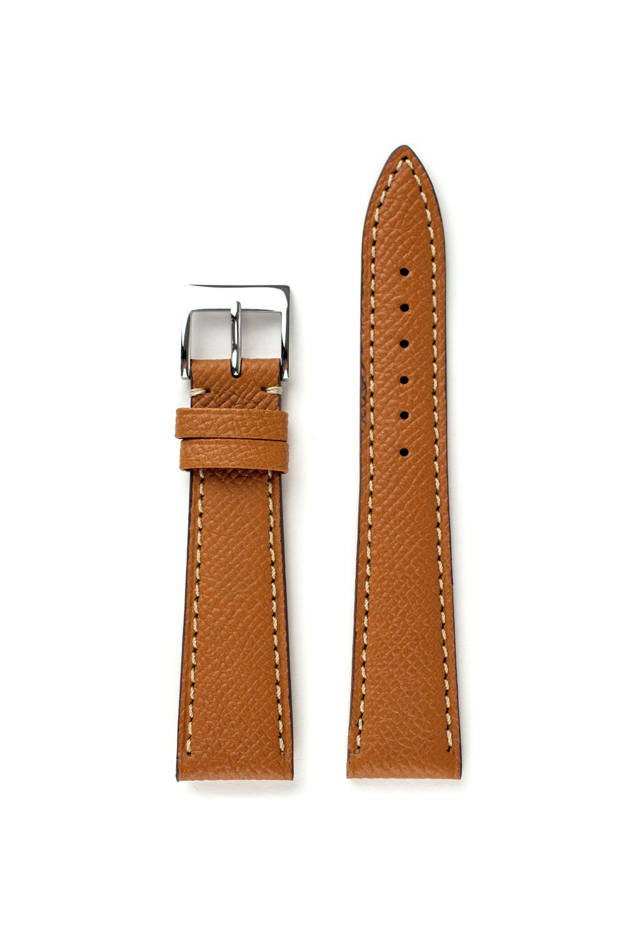 Het LIC Epsom Cognac - Kalf Leder Horlogeband, modelnummer 8102 AME 16/14 S, is een hoogwaardige leren horlogeband in de categorie STRAP. Het heeft een elegante bruine kleur (STRAP_COLOR: BROWN). Draag het met een klassiek horloge voor een verfijnde look. Perfect voor zowel zakelijke als casual outfits.