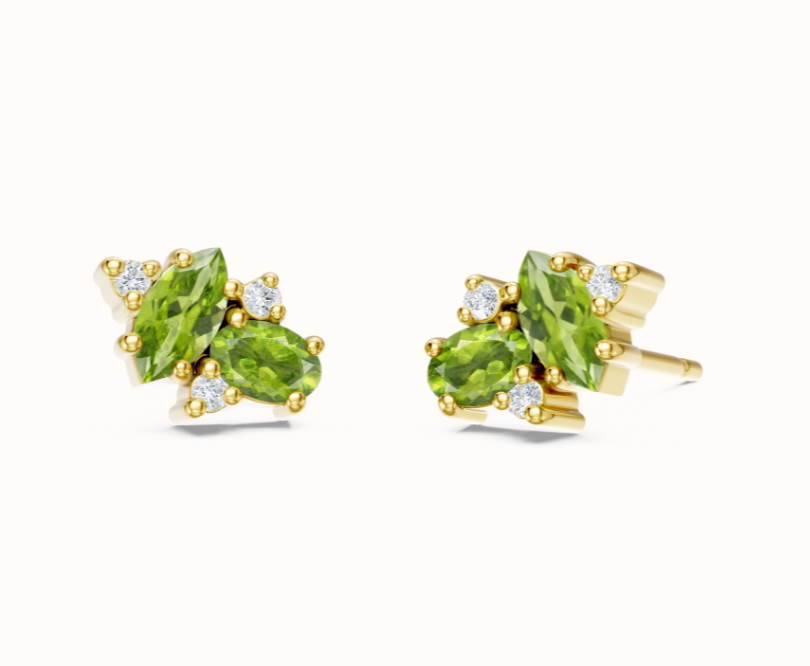 A nod to vintage glamour, these fine stud earrings feature a delicate cluster of 2x oval peridot gemstones accented with scattered white diamonds. The delicate combination of fresh green and timeless sparkle brings a touch of the peacock&rsquo;s vibrant beauty to your everyday look. Crafted in 925 sterling silver, they&rsquo;re perfect for adding a subtle yet striking pop of color.